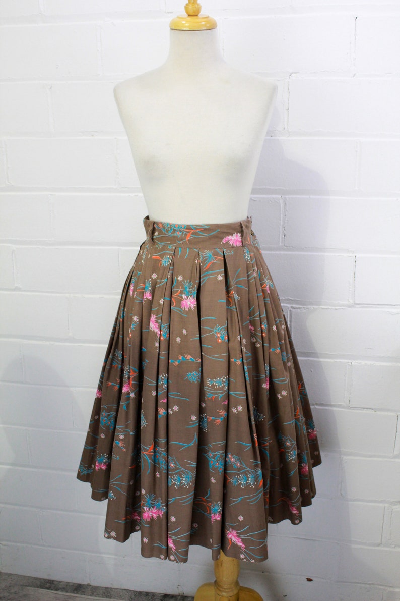1950s brown cotton full pleated skirt with novelty pink blue and orange floral print, belt loops, high waisted metal zipper