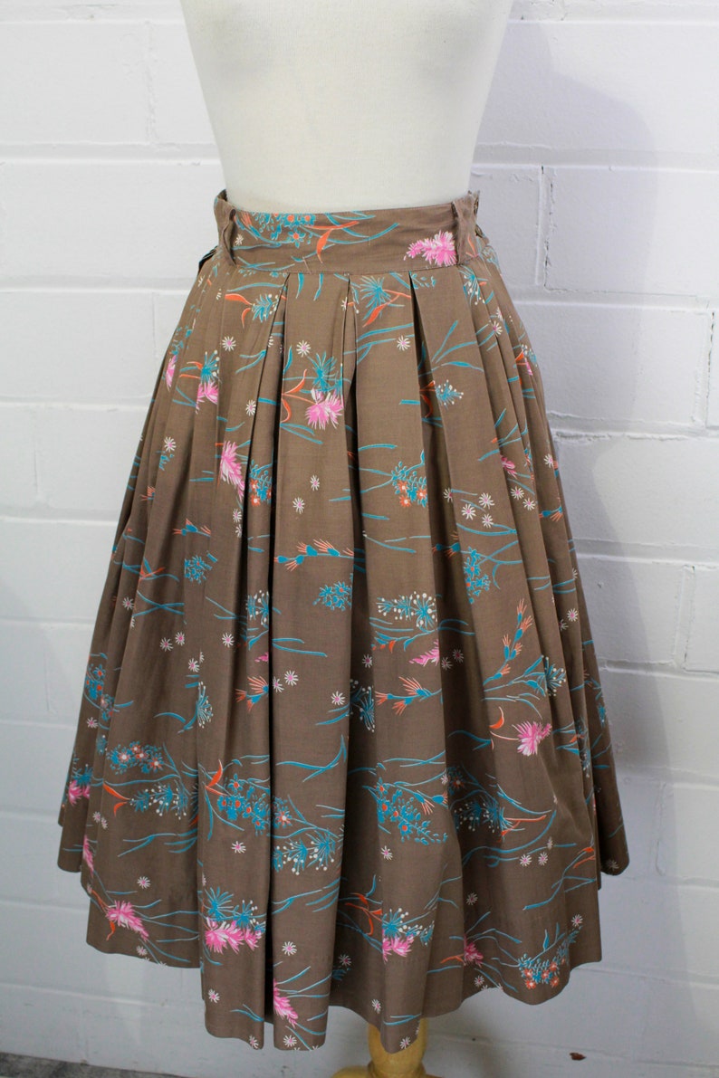 1950s brown cotton full pleated skirt with novelty pink blue and orange floral print, belt loops, high waisted metal zipper