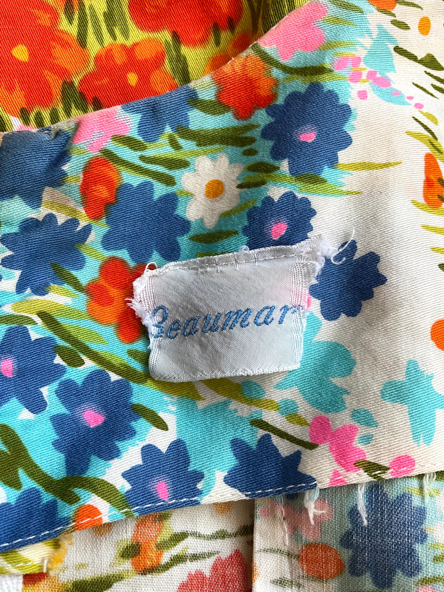 Floral-patterned fabric with a visible brand tag