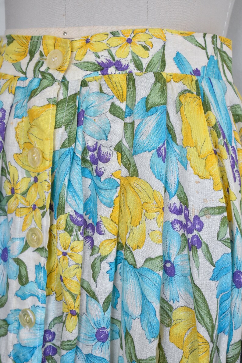 1950s j tiktiner blue and yellow floral print linen cotton blend skirt with button front, gathered waist