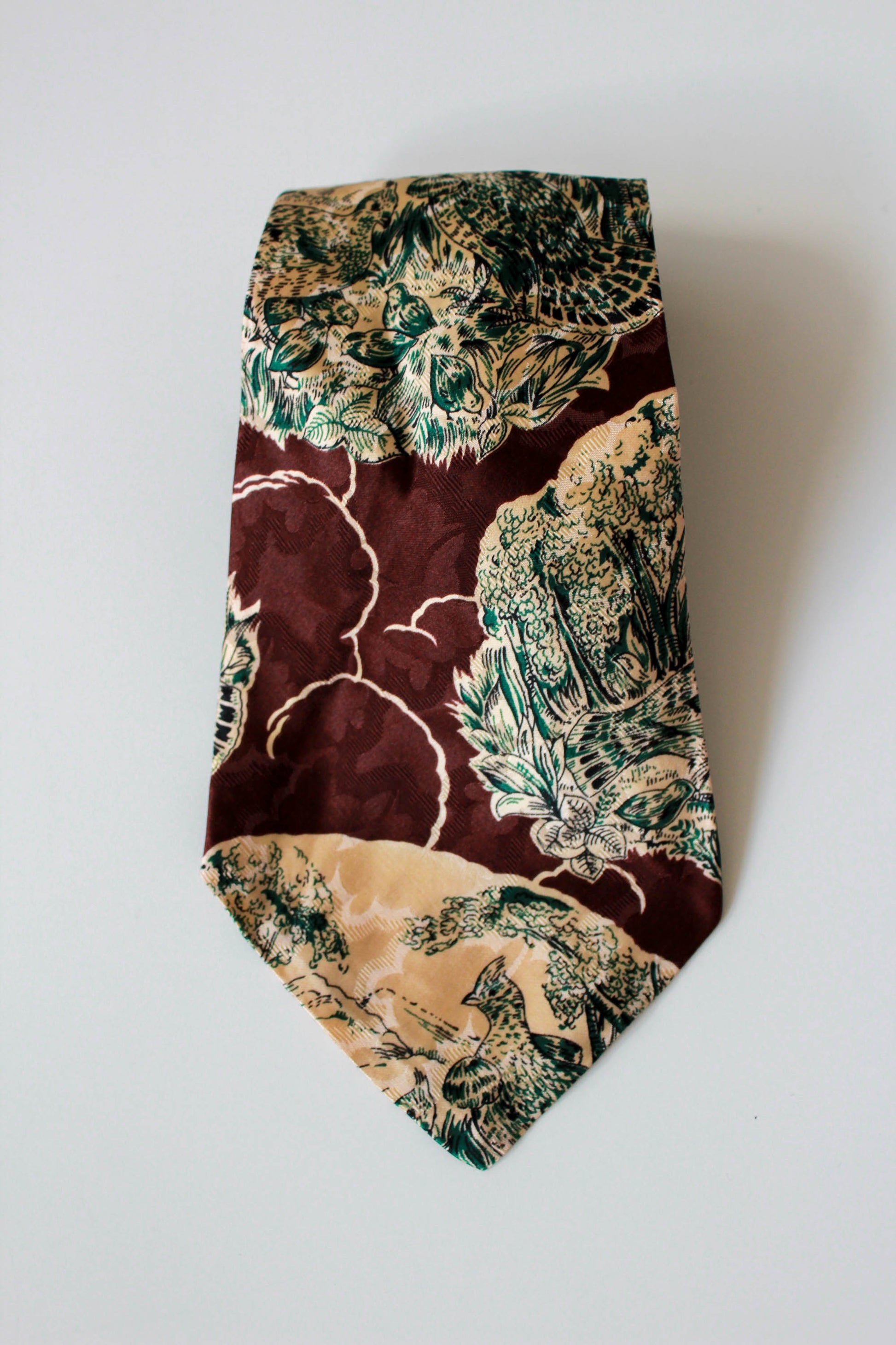 1940s superba rayon necktie, brown with green and beige bird and landscape illustration, wide tongue rayon tie