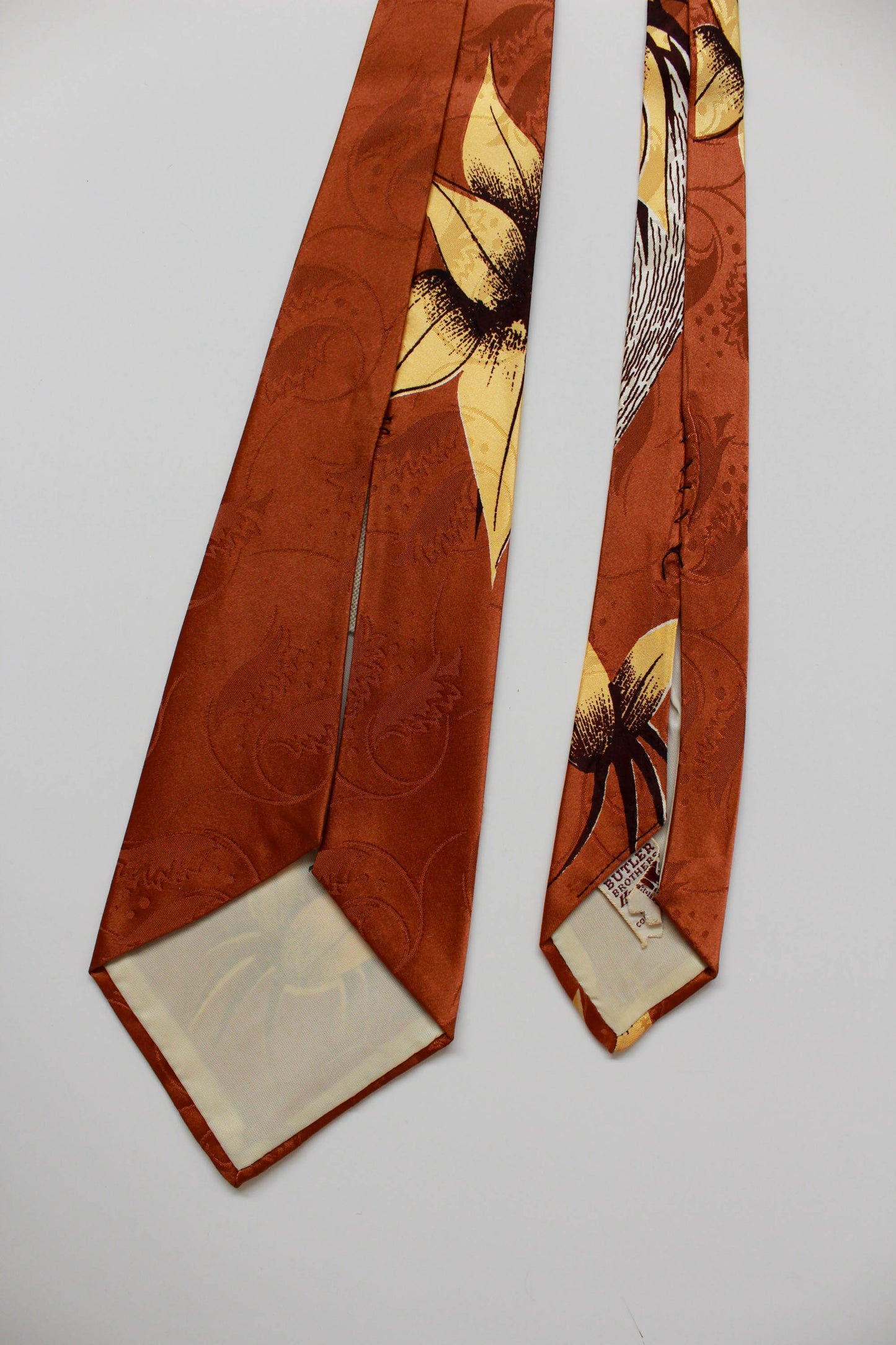 1940s brown rayon necktie with abstrack yellow illustration print vintage bold look wide tongue tie by butler brothers