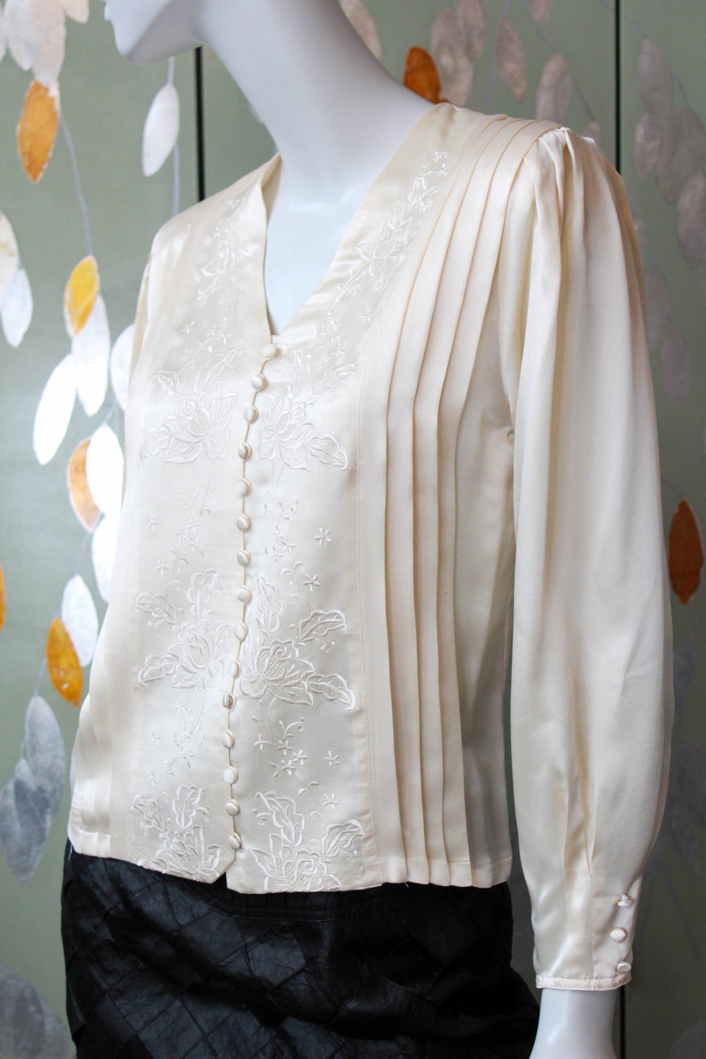 romantic liquid silk satin cream blouse with floral embroidered front, pleating detail, covered buttons and long puff sleeves. coquette aesthetic