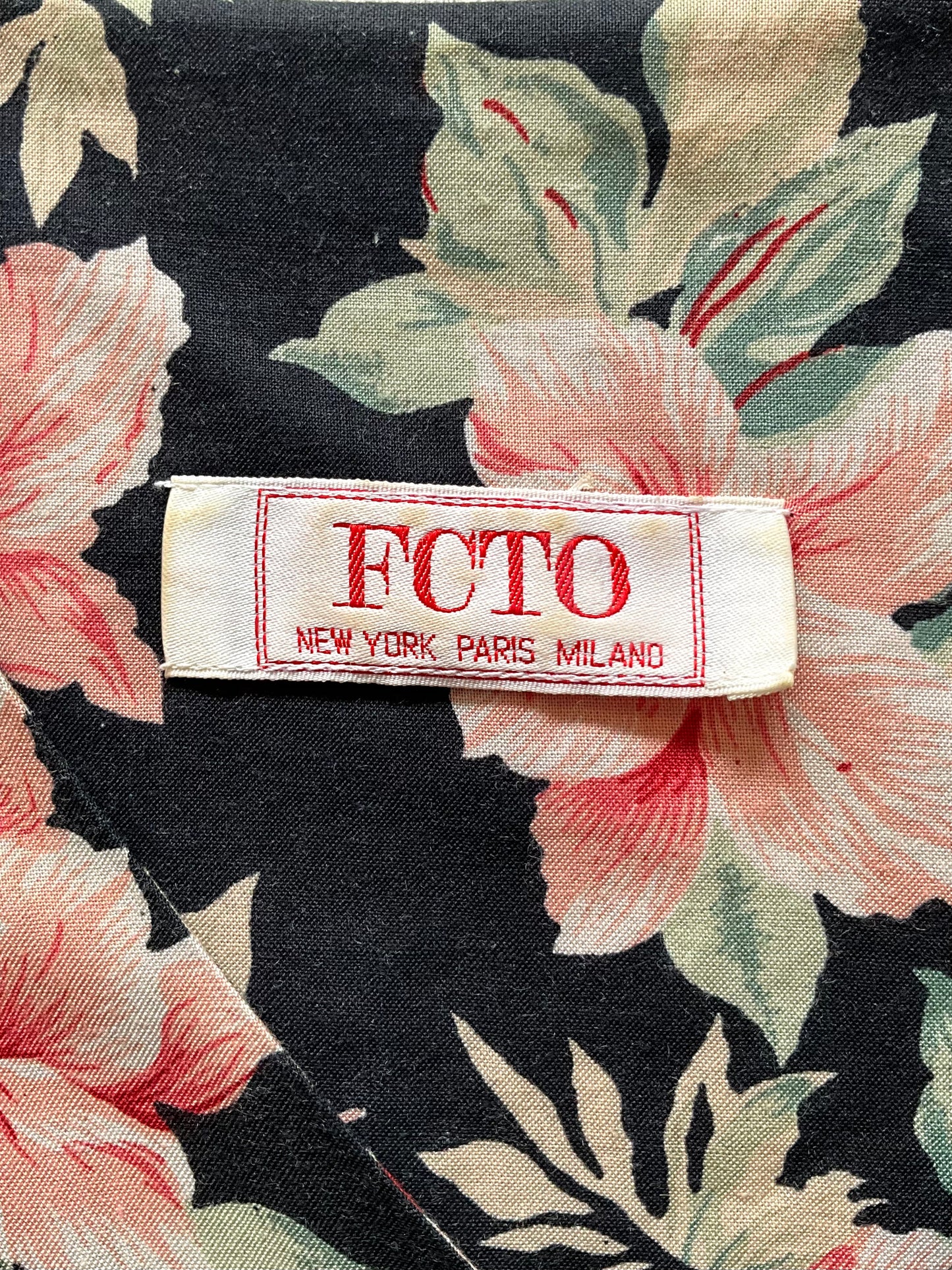 Floral fabric with a visible label reading 'FCTO New York Paris Milano'.