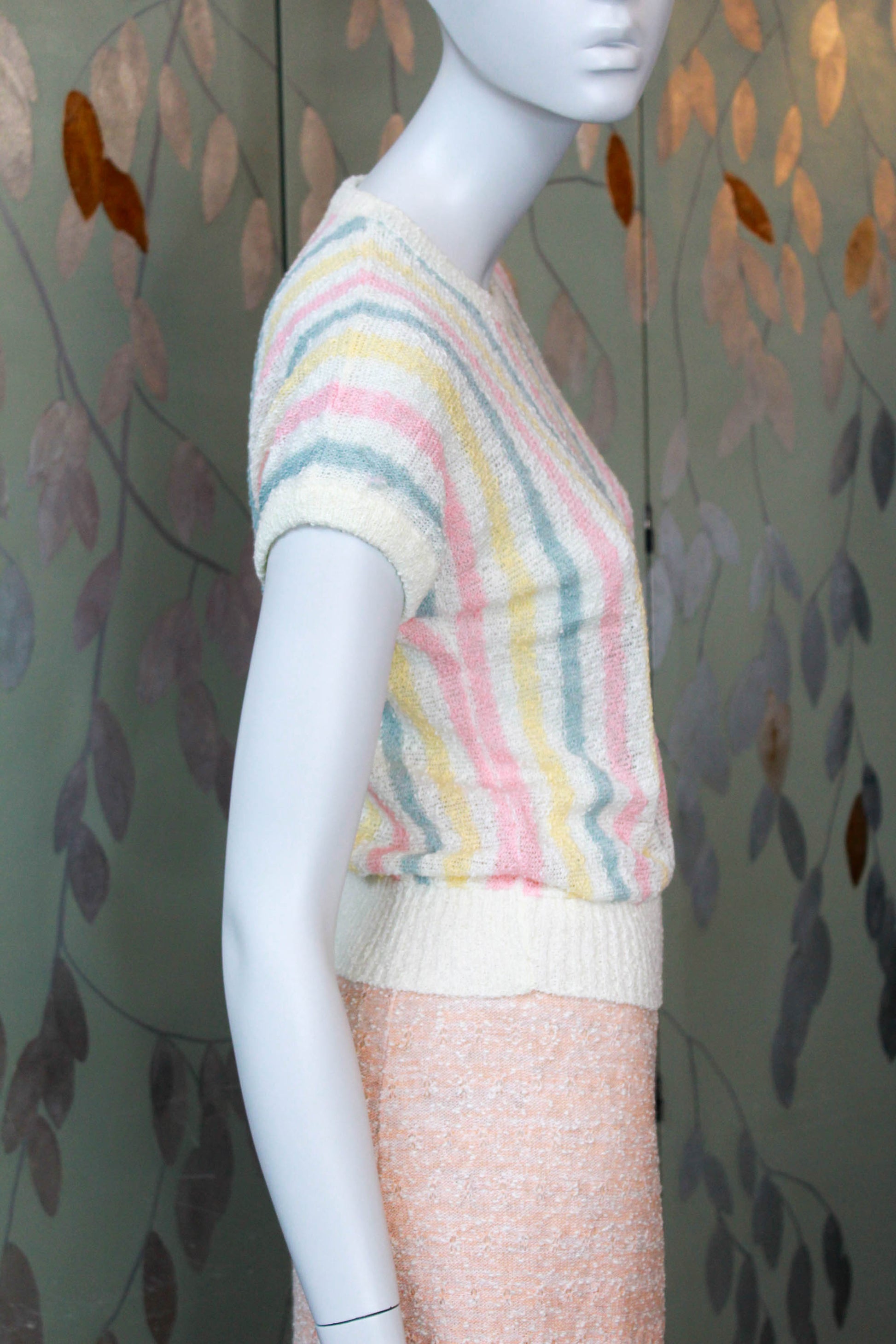 80s deadstock knit short sleeve top with vertical pink, yellow and green stripes against cream, ribbed hem