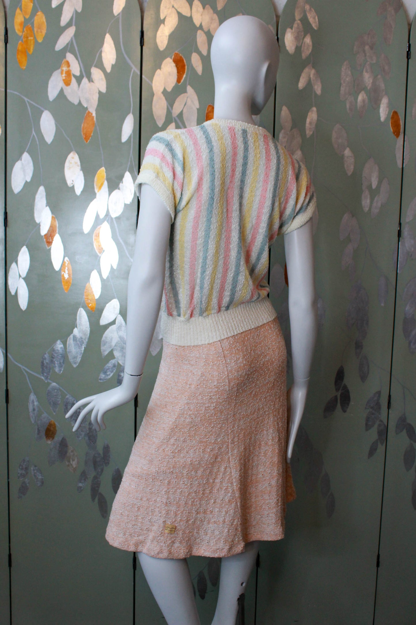 80s deadstock knit short sleeve top with vertical pink, yellow and green stripes against cream, ribbed hem