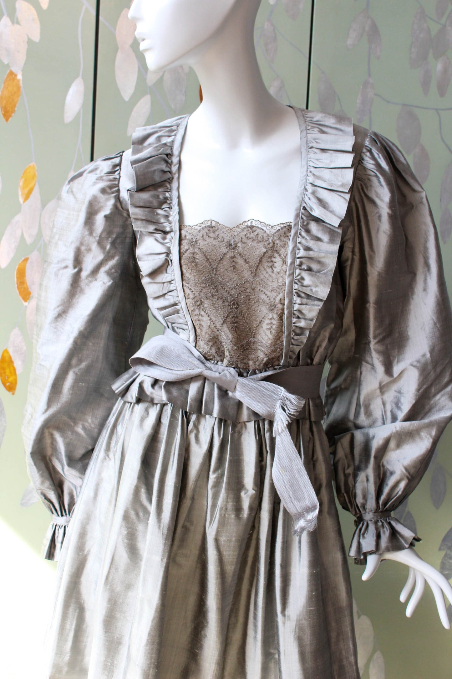 1980s pewter grey/shimmering silk blouse and skirt with ruffled detail on the front, lace panel overlay, corset style blouse with large puff sleeves and gathered full skirt with ruffle hem, maxi length.