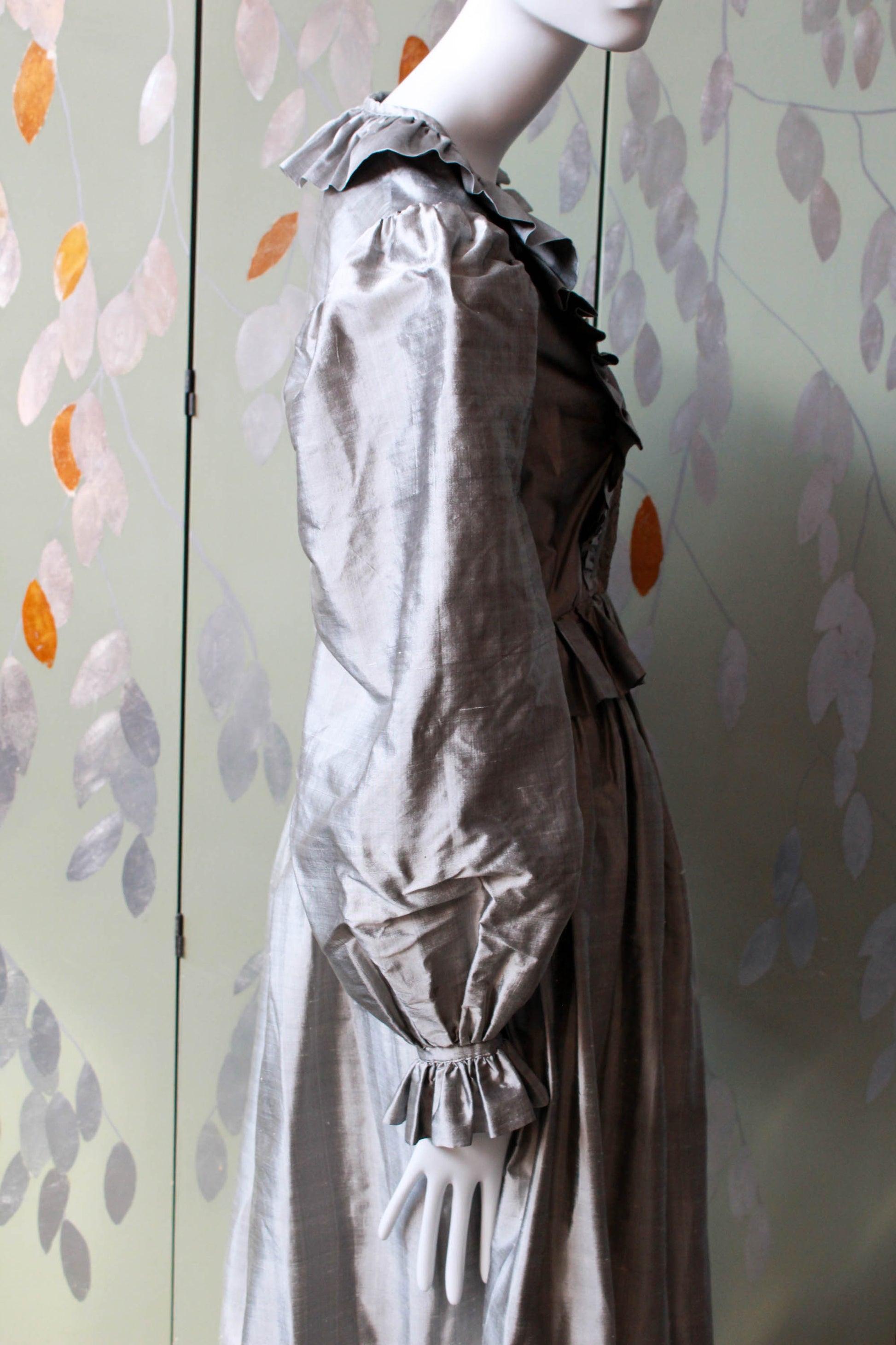 1980s pewter grey/shimmering silk blouse and skirt with ruffled detail on the front, lace panel overlay, corset style blouse with large puff sleeves and gathered full skirt with ruffle hem, maxi length.