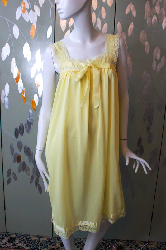 1960s lemon yellow night gown with lace trim and a bow coquette aesthetic vintage