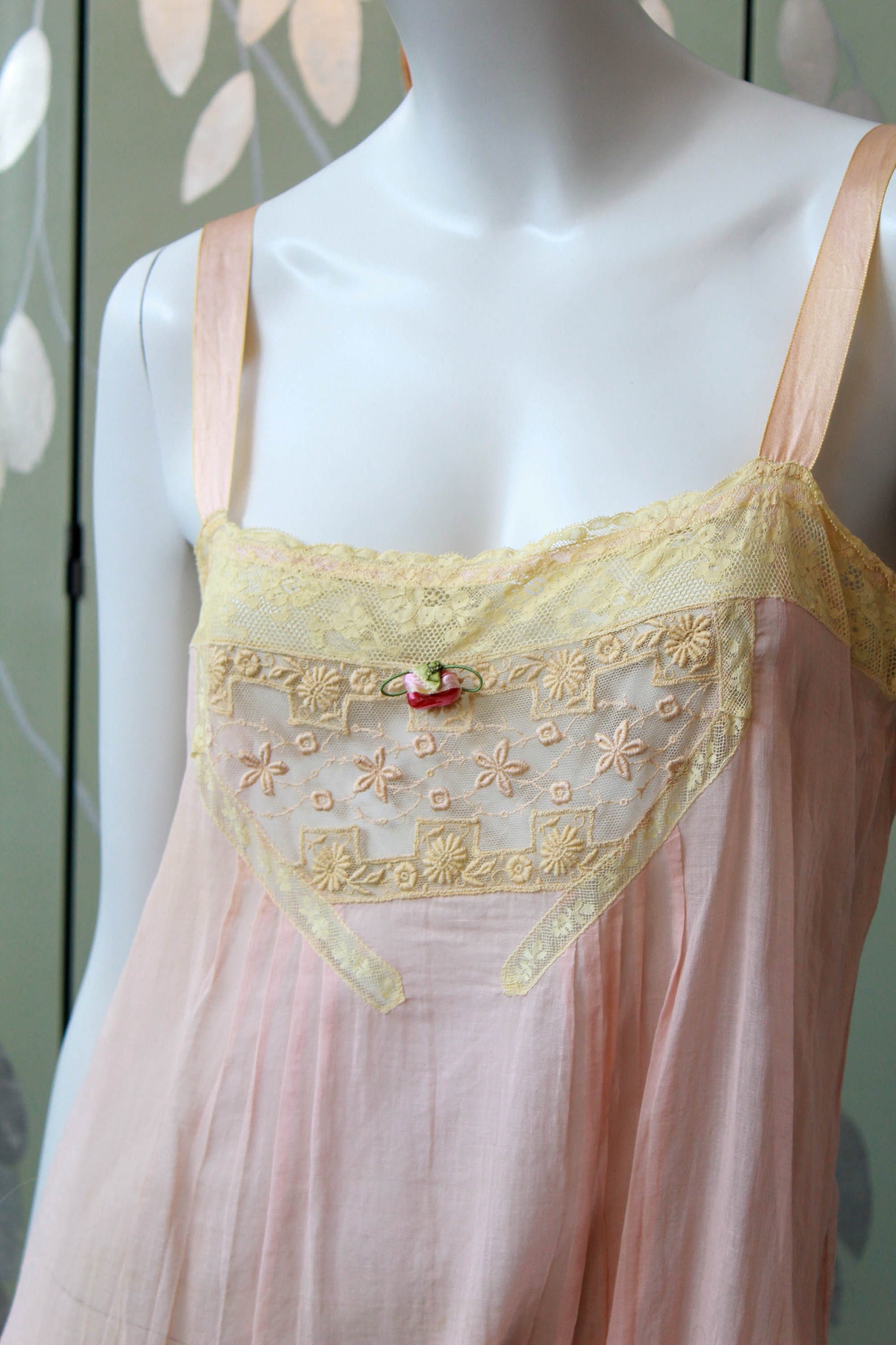 1920s pink cotton step in with lace insert at bust and flower applique. Ribbon straps. Slit up legs, lace trim. antique lingerie flapper style
