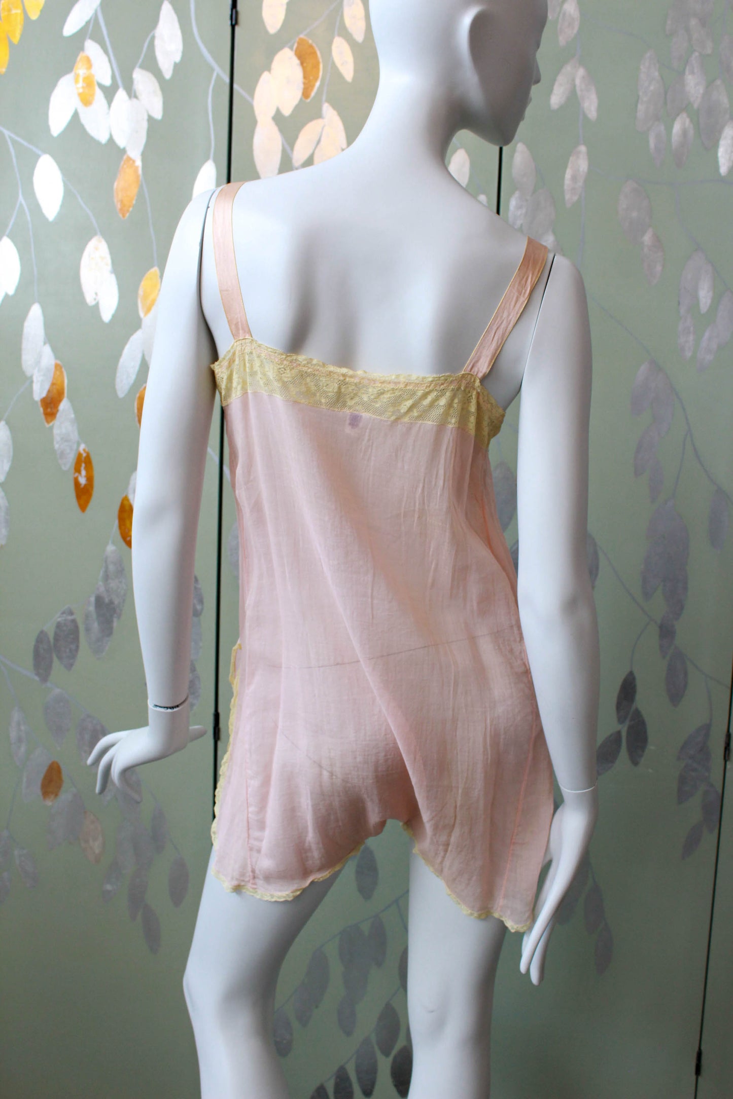 1920s pink cotton step in with lace insert at bust and flower applique. Ribbon straps. Slit up legs, lace trim. antique lingerie flapper style
