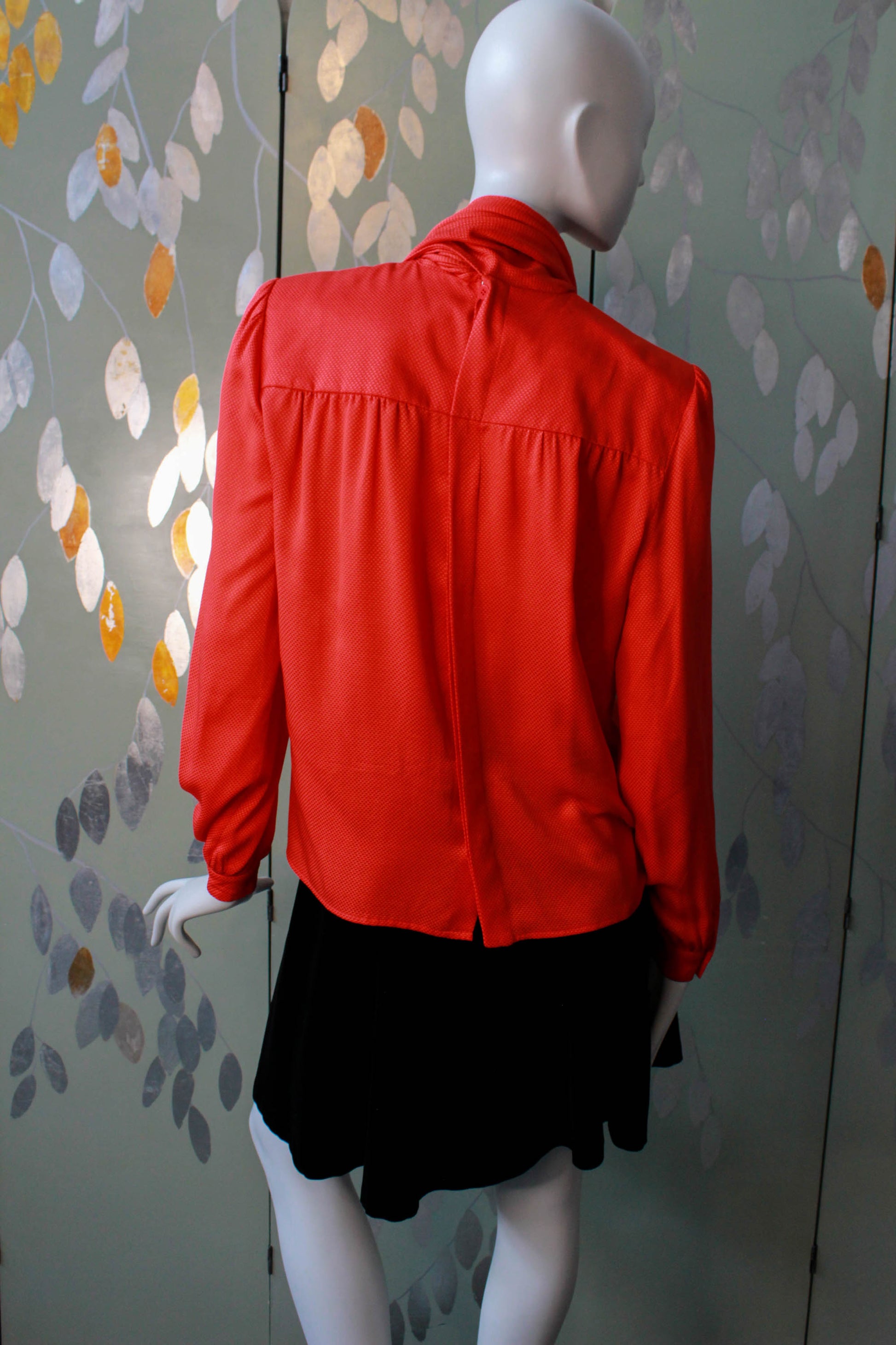 1980s red silk valentino blouse with high scarf neck collar tucked into pocket, gathered bustline, long sleeves