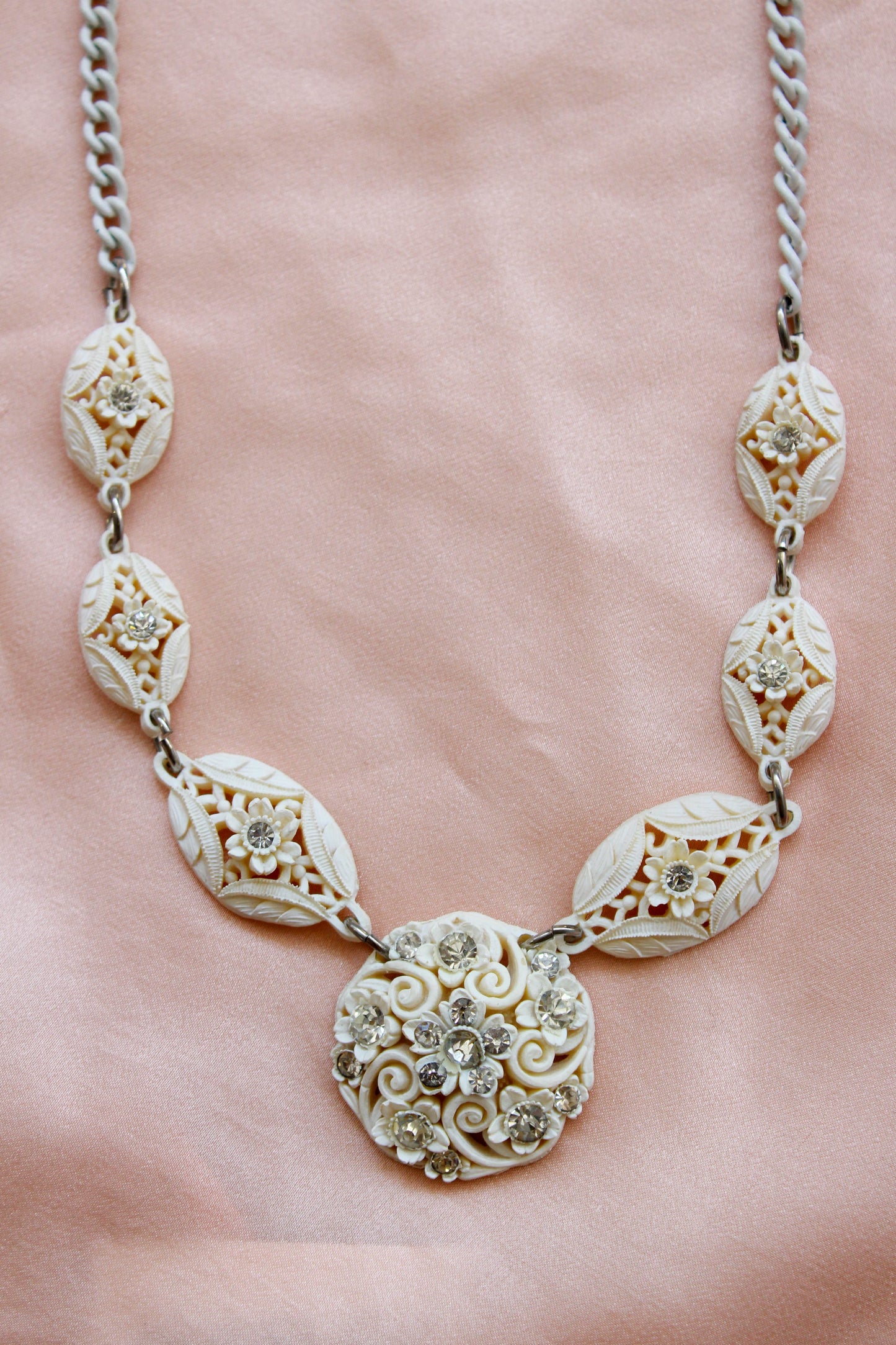 1950s White Carved Celluloid Rhinestone Necklace