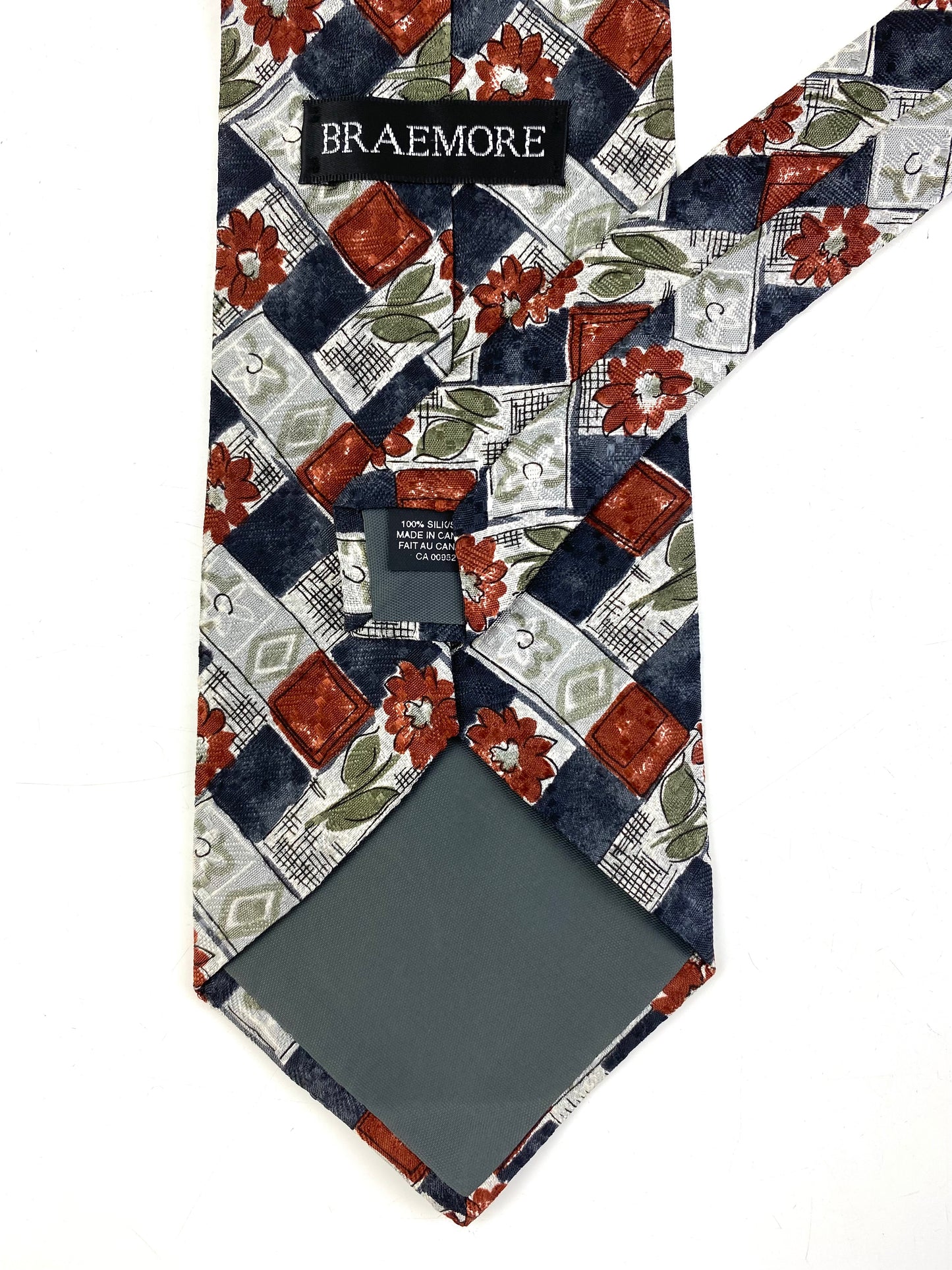 Back and labels of: 90s Deadstock Silk Necktie, Men's Vintage Grey/Brown Floral Lattice Pattern Tie, NOS