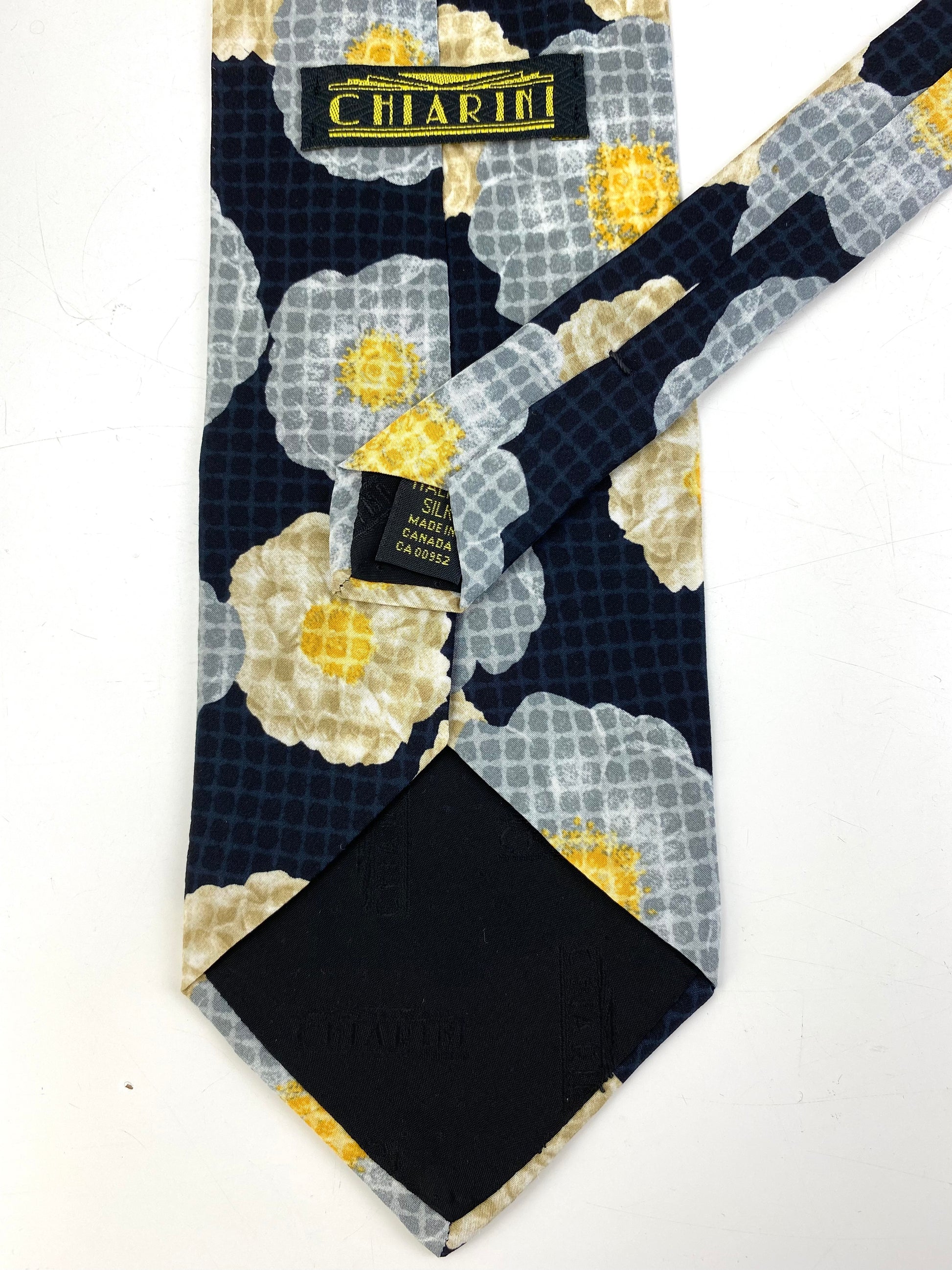 Back and labels of: 90s Deadstock Silk Necktie, Men's Vintage Black/ Grey Floral Pattern Tie, NOS