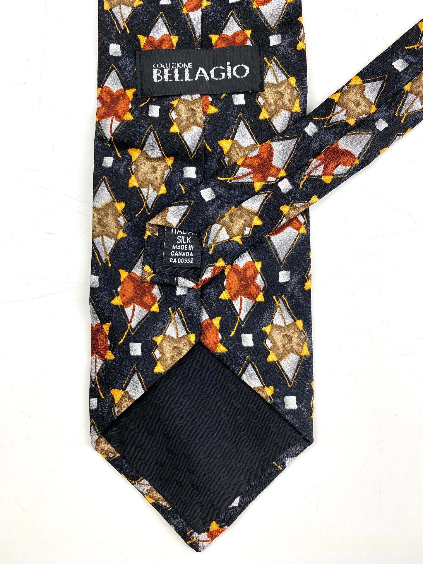 Back and labels of: 90s Deadstock Silk Necktie, Men's Vintage Grey/ Rust/ Yellow Floral Diamond Pattern Tie, NOS