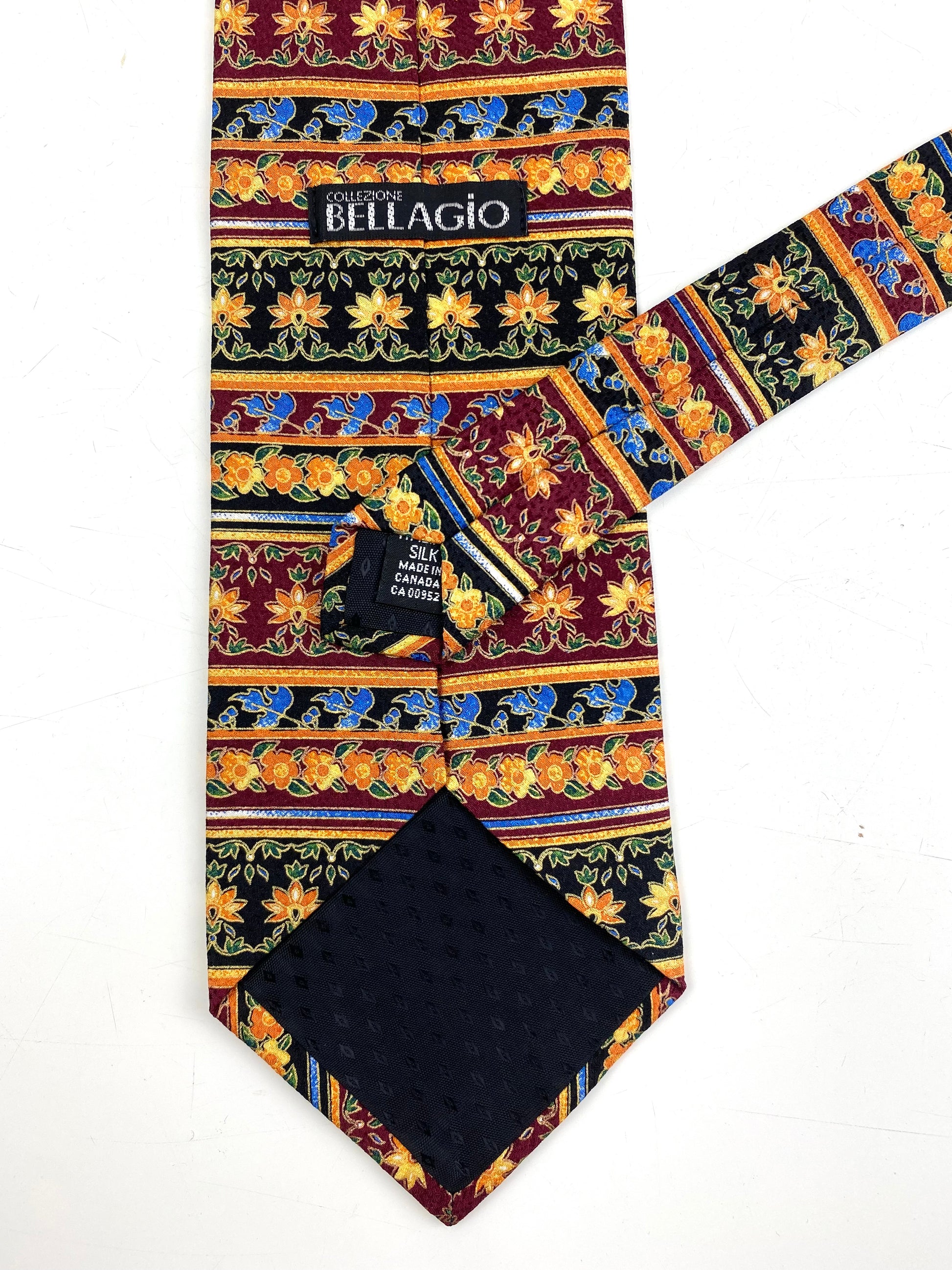 Back and labels of: 90s Deadstock Silk Necktie, Men's Vintage Orange/ Maroon/ Blue Floral Horizontal Stripe Pattern Tie, NOS