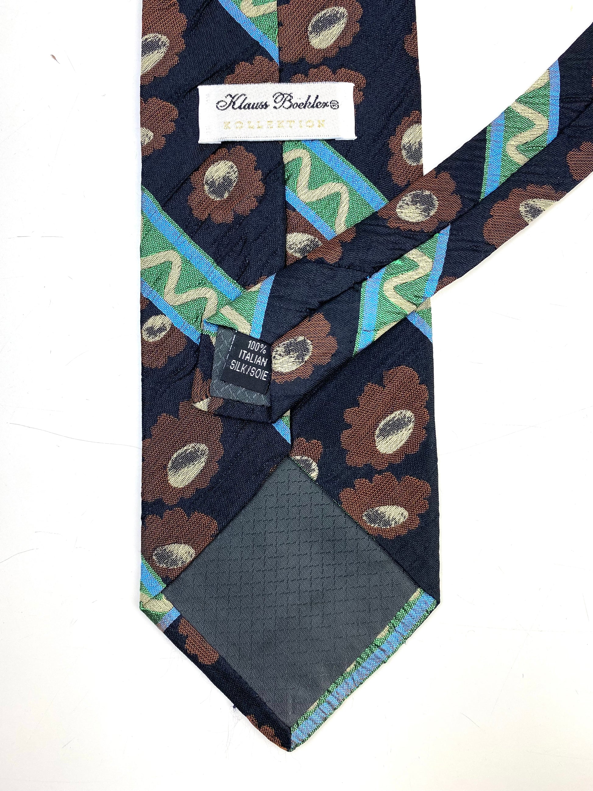 Back and labels of: 90s Deadstock Silk Necktie, Men's Vintage Brown/ Green/ Blue Floral Stripe Pattern Tie, NOS