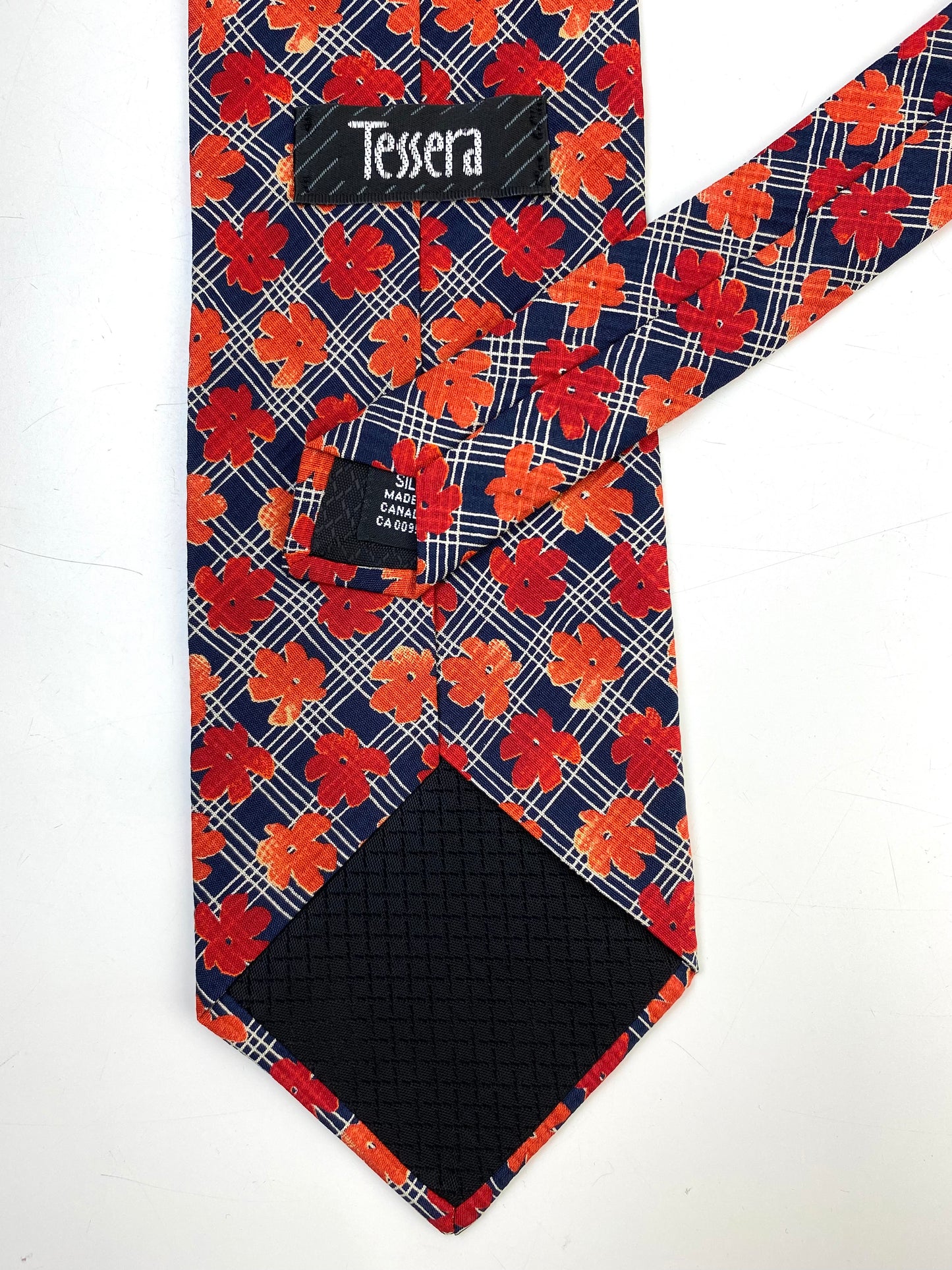 Back and labels of: 90s Deadstock Silk Necktie, Men's Vintage Navy/ Orange/ Red Floral Pattern Tie, NOS