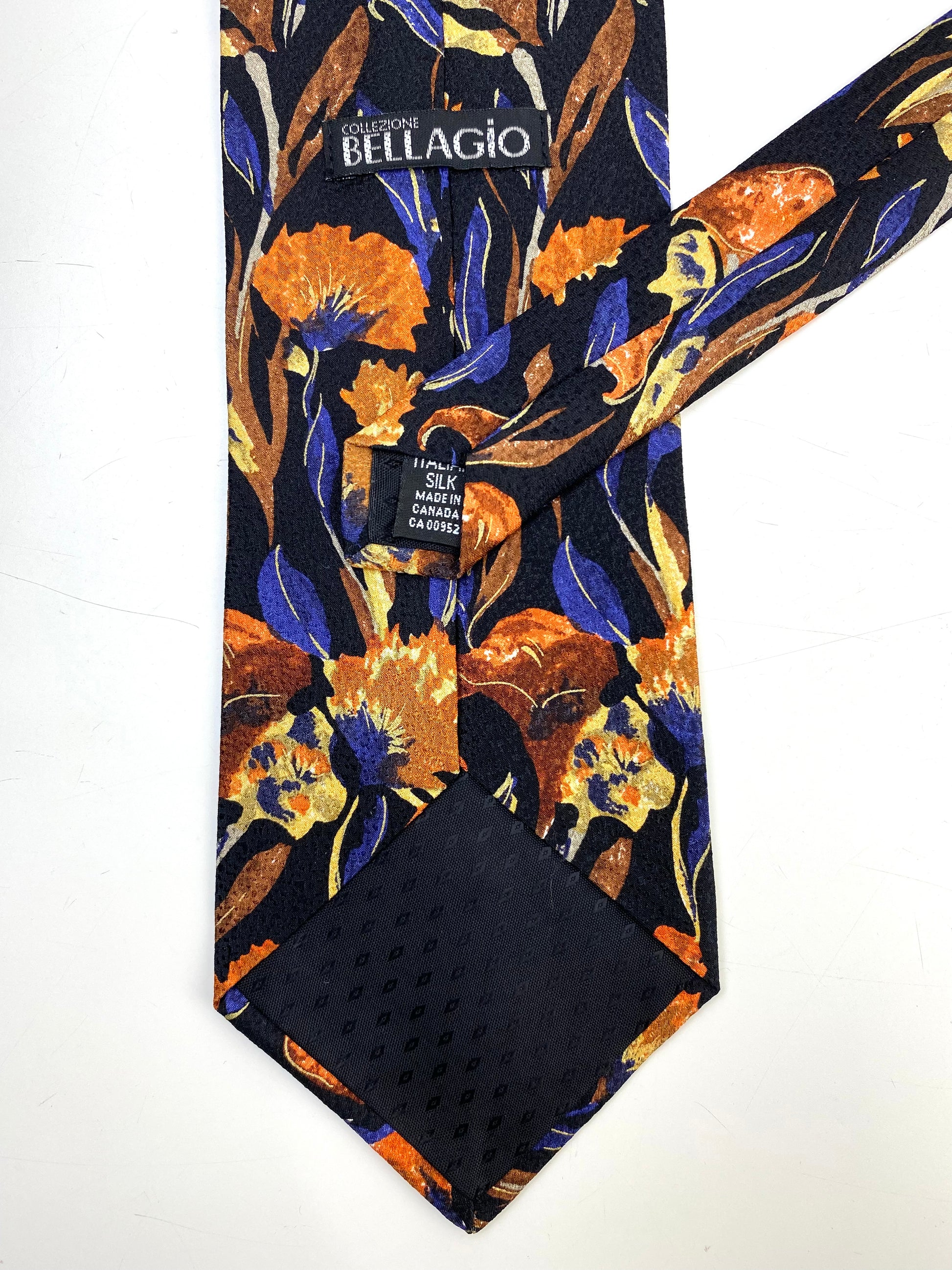 Back and labels of: 90s Deadstock Silk Necktie, Men's Vintage Orange/ Black/ Purple Floral Pattern Tie, NOS