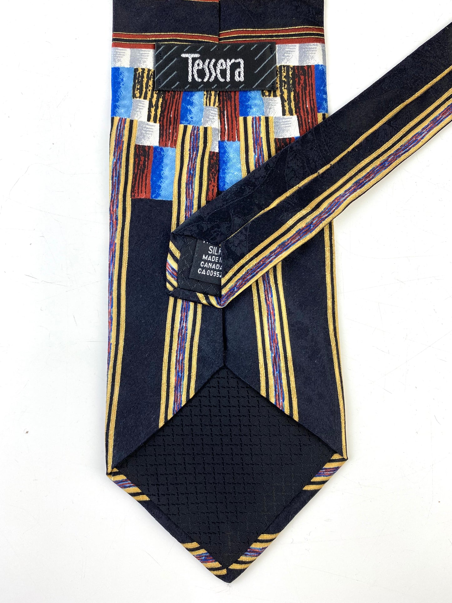 Back detail of: 90s Deadstock Silk Necktie, Men's Vintage Black/ Blue/ Gold/ Umber Geometric Pattern Tie, NOS