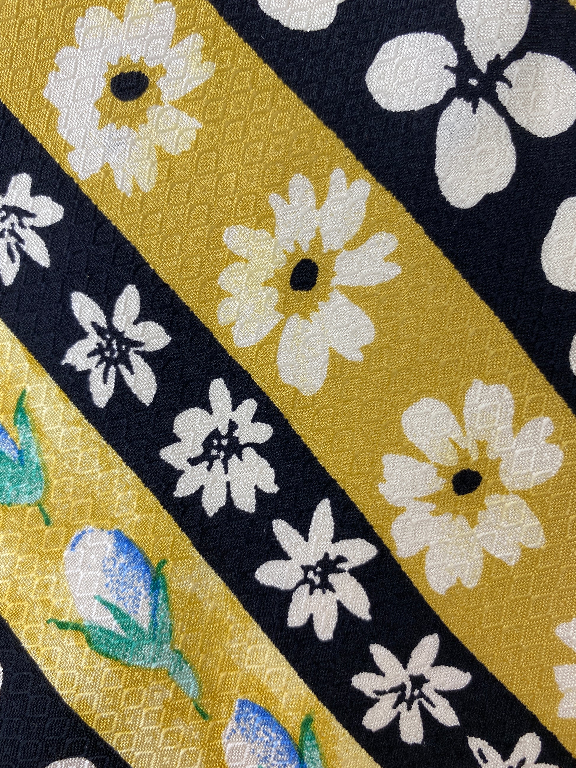Close-up of patterned variant of: 90s Deadstock Silk Necktie, Men's Vintage Gold/Black Diagonal Stripe Floral Pattern Tie, NOS