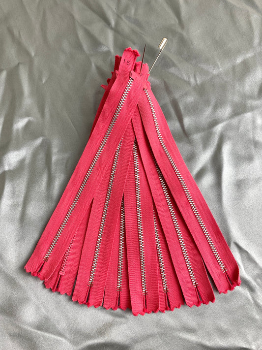 A batch of pink metal zippers. Ian Drummond Vintage. 