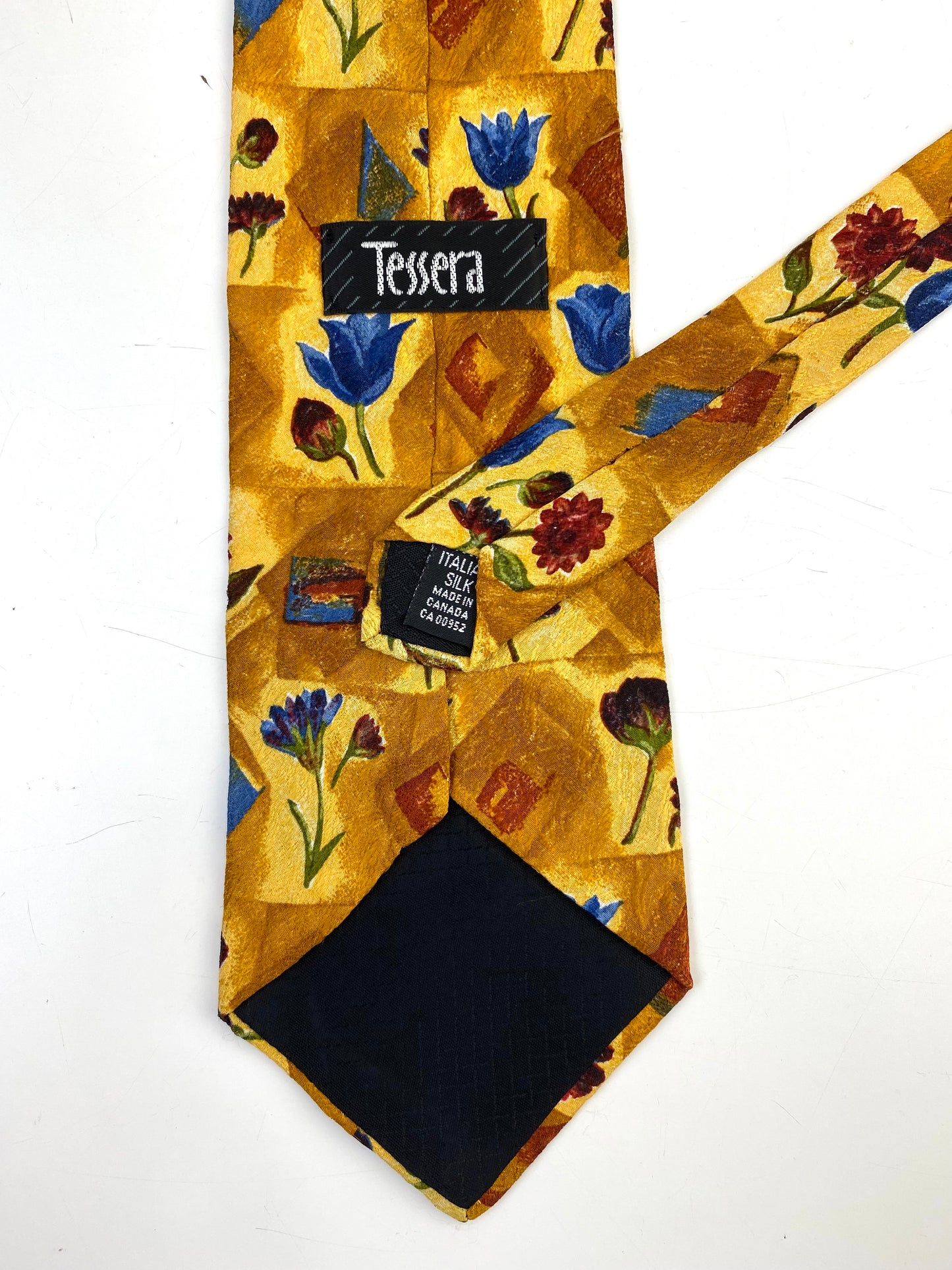 Back and labels of: 90s Deadstock Silk Necktie, Men's Vintage Blue Tulip/ Red Daisy Floral Pattern Gold Tie, NOS