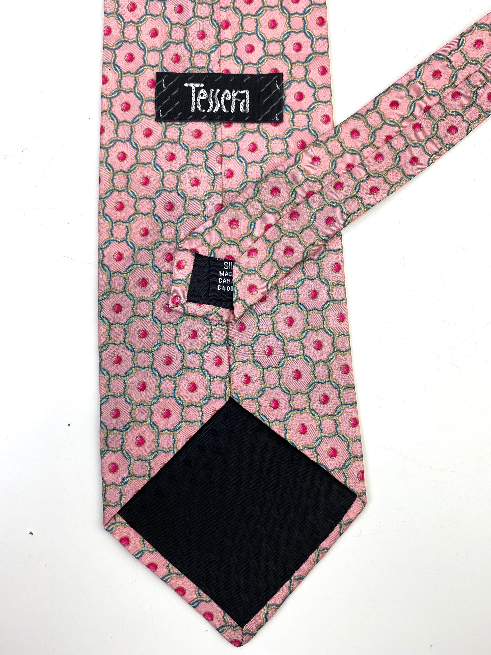 Back and labels of: 90s Deadstock Silk Necktie, Men's Vintage Pink Quatrefoil Link Pattern Tie, NOS