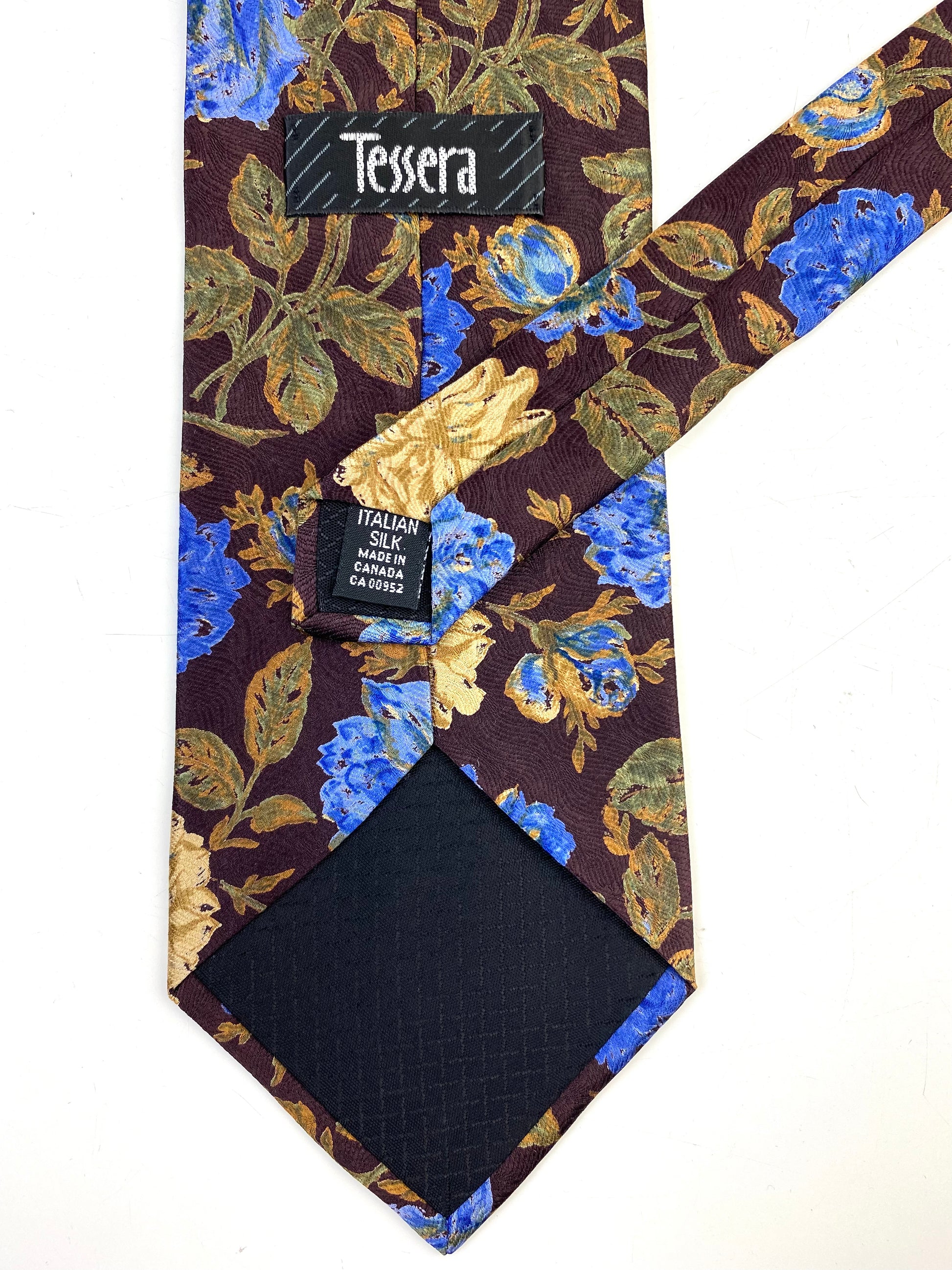 Back and labels of: 90s Deadstock Silk Necktie, Men's Vintage Wine/ Green/ Blue Floral Pattern Tie, NOS