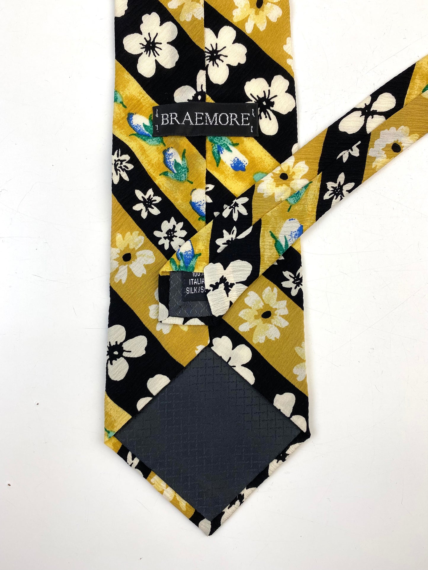 Back and labels of: 90s Deadstock Silk Necktie, Men's Vintage Gold/Black Diagonal Stripe Floral Pattern Tie, NOS