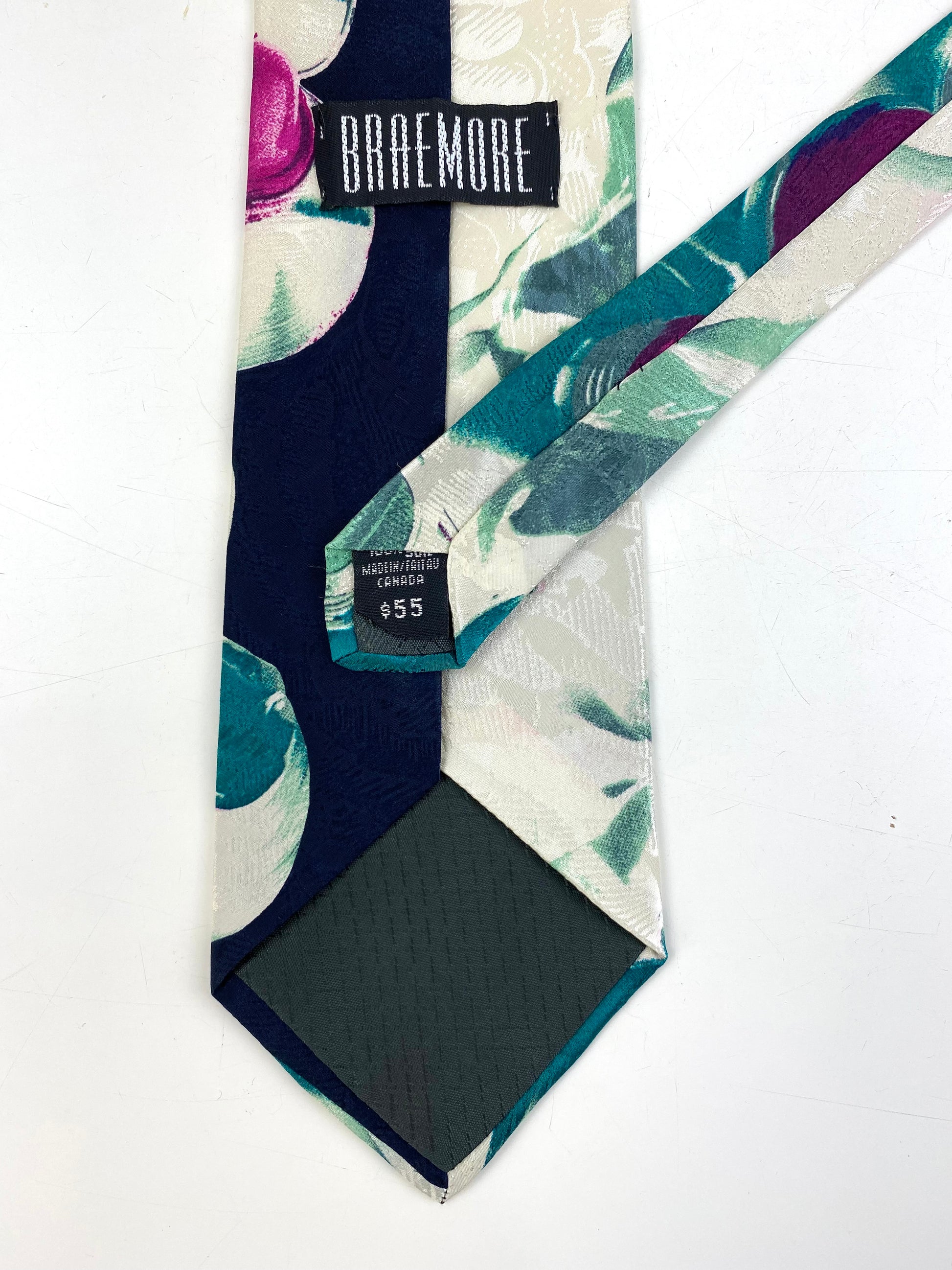 Back and labels of: 90s Deadstock Silk Necktie, Men's Vintage Teal/ White/ Purple Abstract Pattern Tie, NOS
