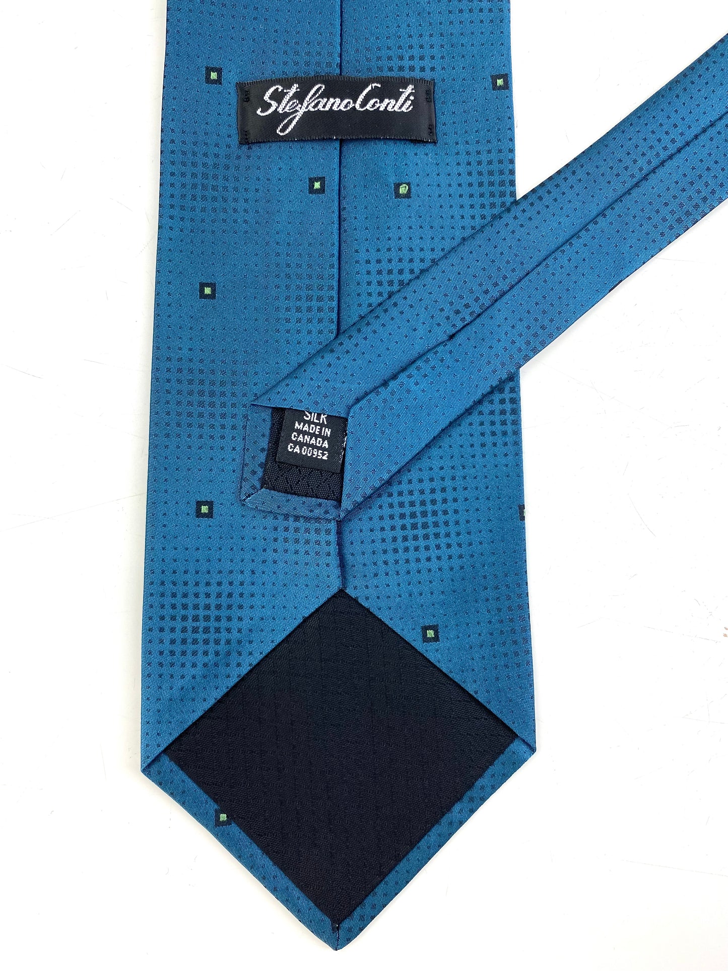 Back and labels of: 90s Deadstock Silk Necktie, Men's Vintage Teal Micro Square Pattern Tie, NOS