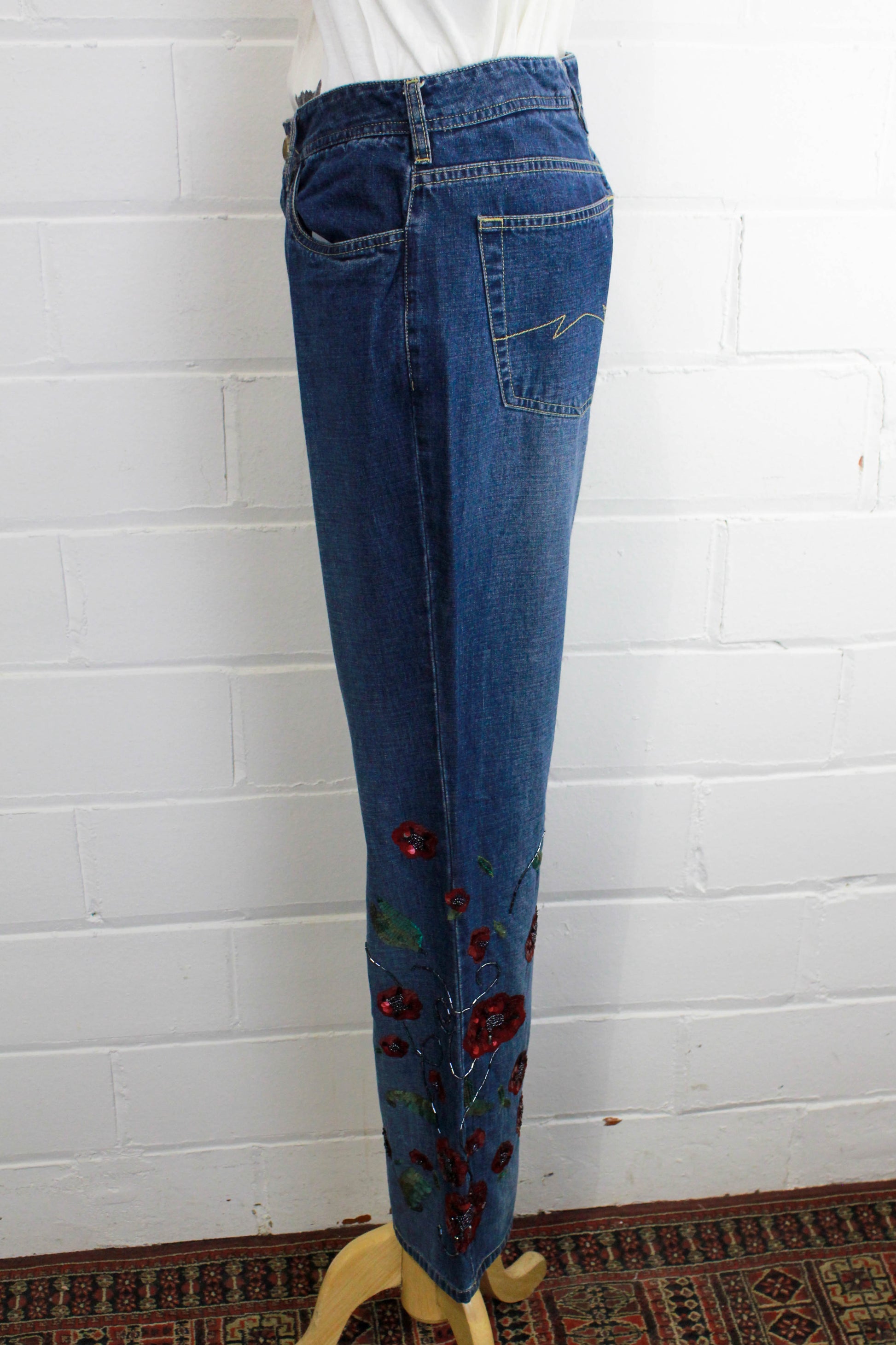 side view of womens flared blue jeans