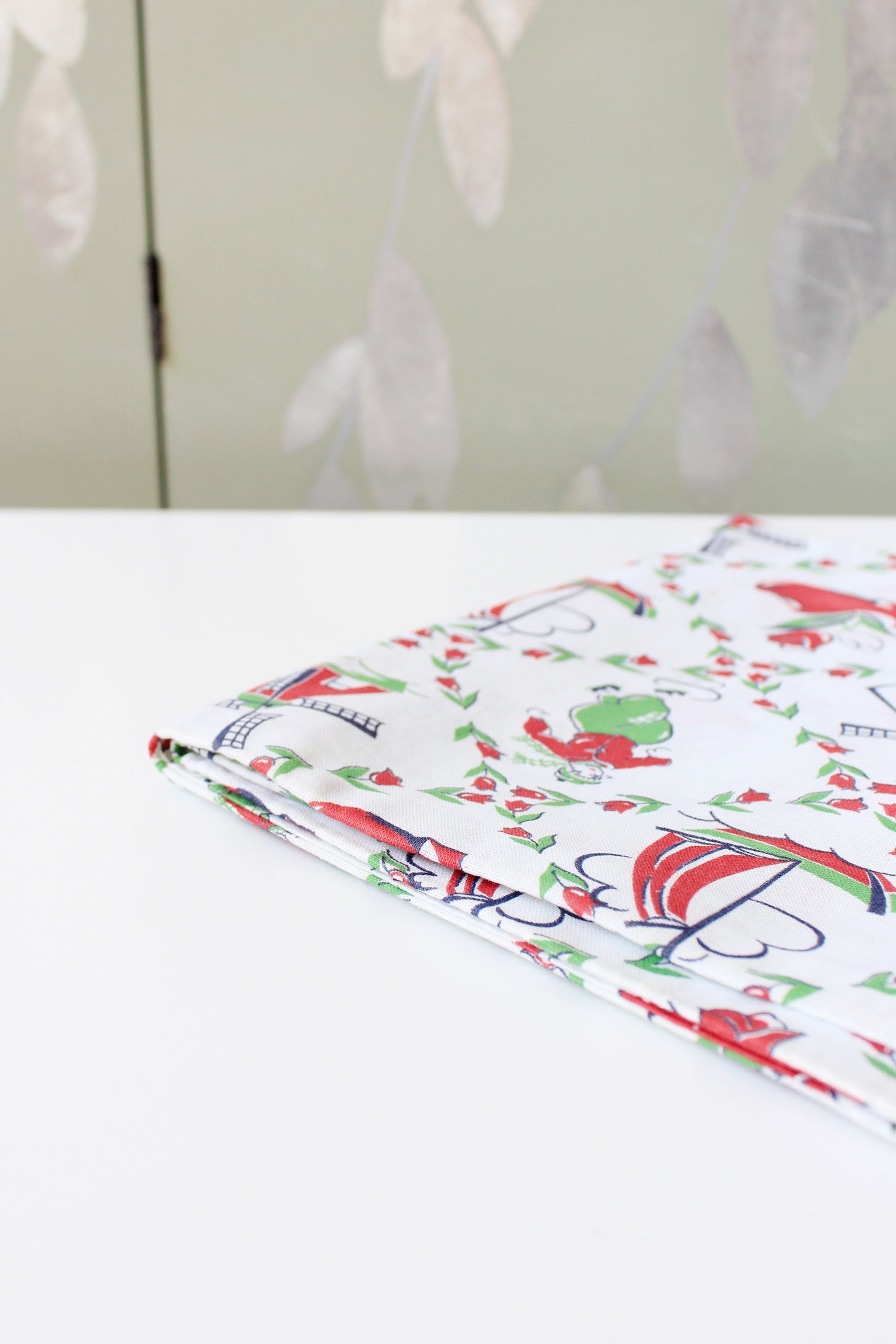 1940s Red And Green Dutch Illustration Feedsack featuring Ice Skaters And Windmills, Vintage Sewing/Quilting Fabric