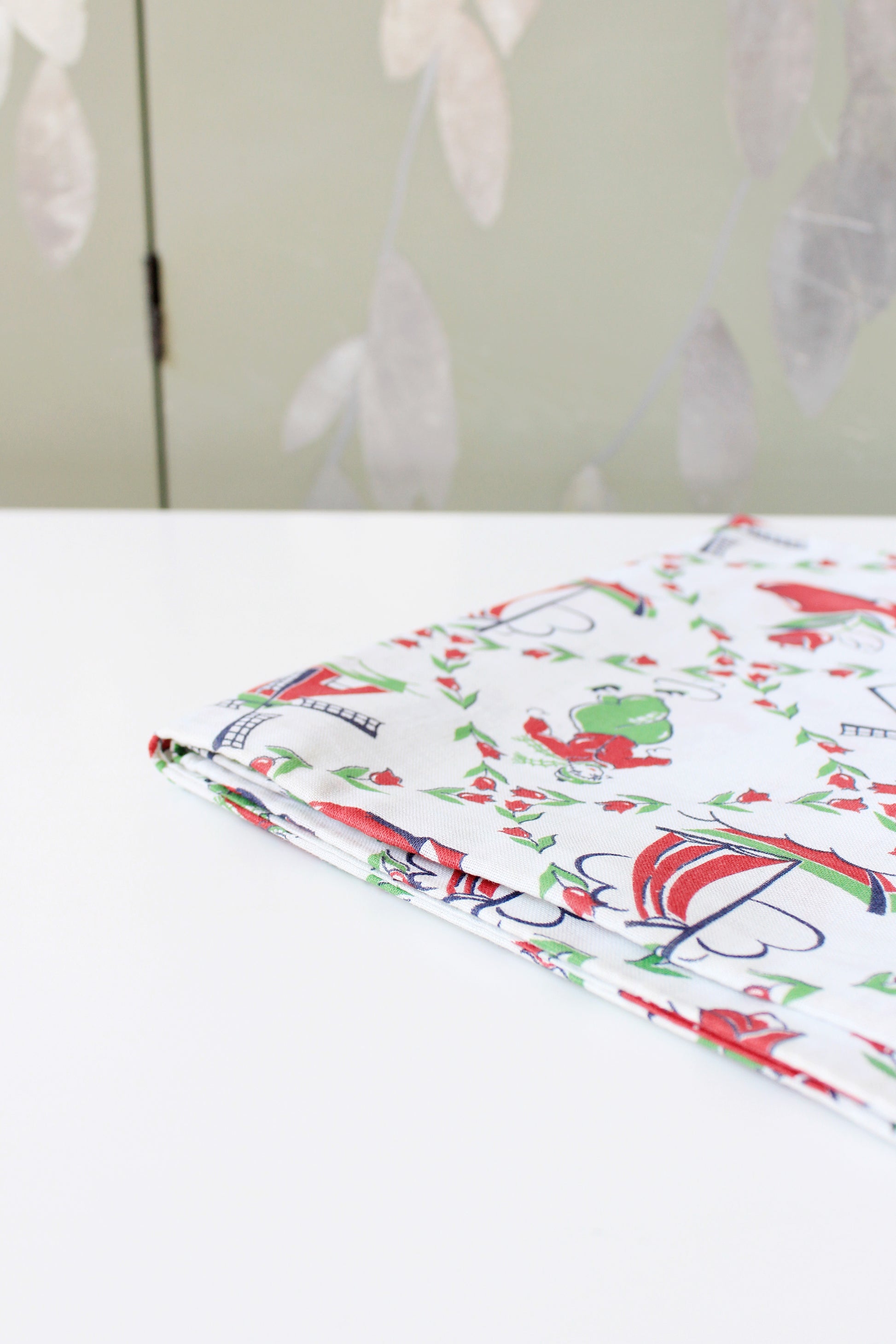 1940s Red And Green Dutch Illustration Feedsack featuring Ice Skaters And Windmills, Vintage Sewing/Quilting Fabric