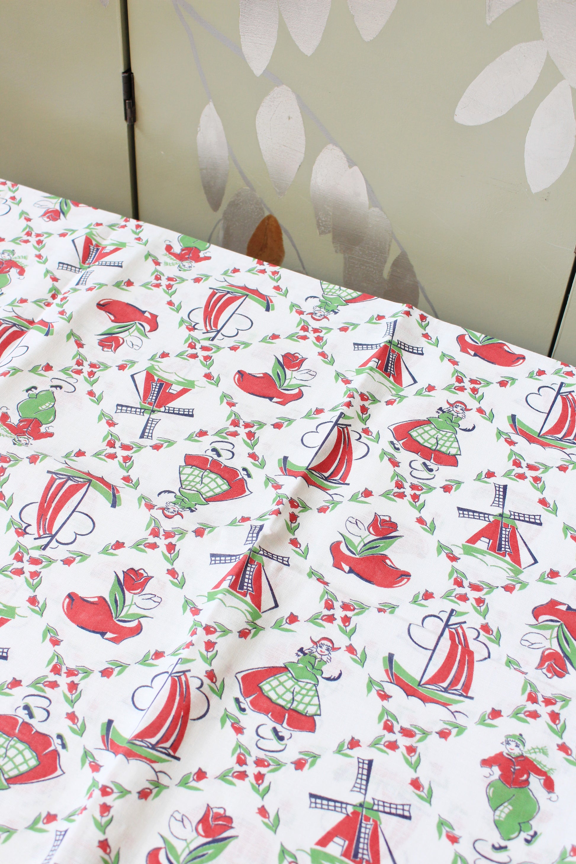 1940s Red And Green Dutch Illustration Feedsack featuring Ice Skaters And Windmills, Vintage Sewing/Quilting Fabric