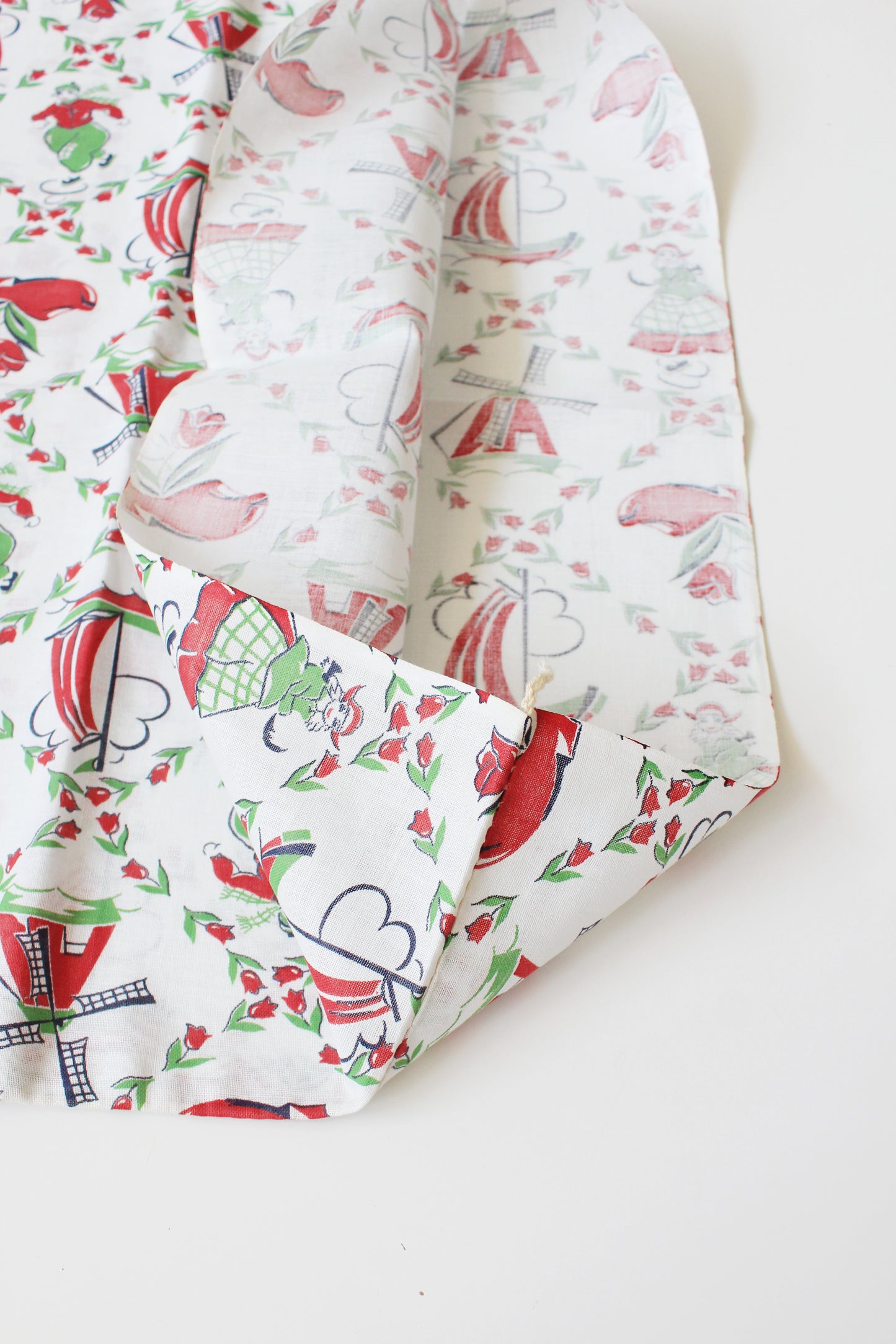 1940s Red And Green Dutch Illustration Feedsack featuring Ice Skaters And Windmills, Vintage Sewing/Quilting Fabric