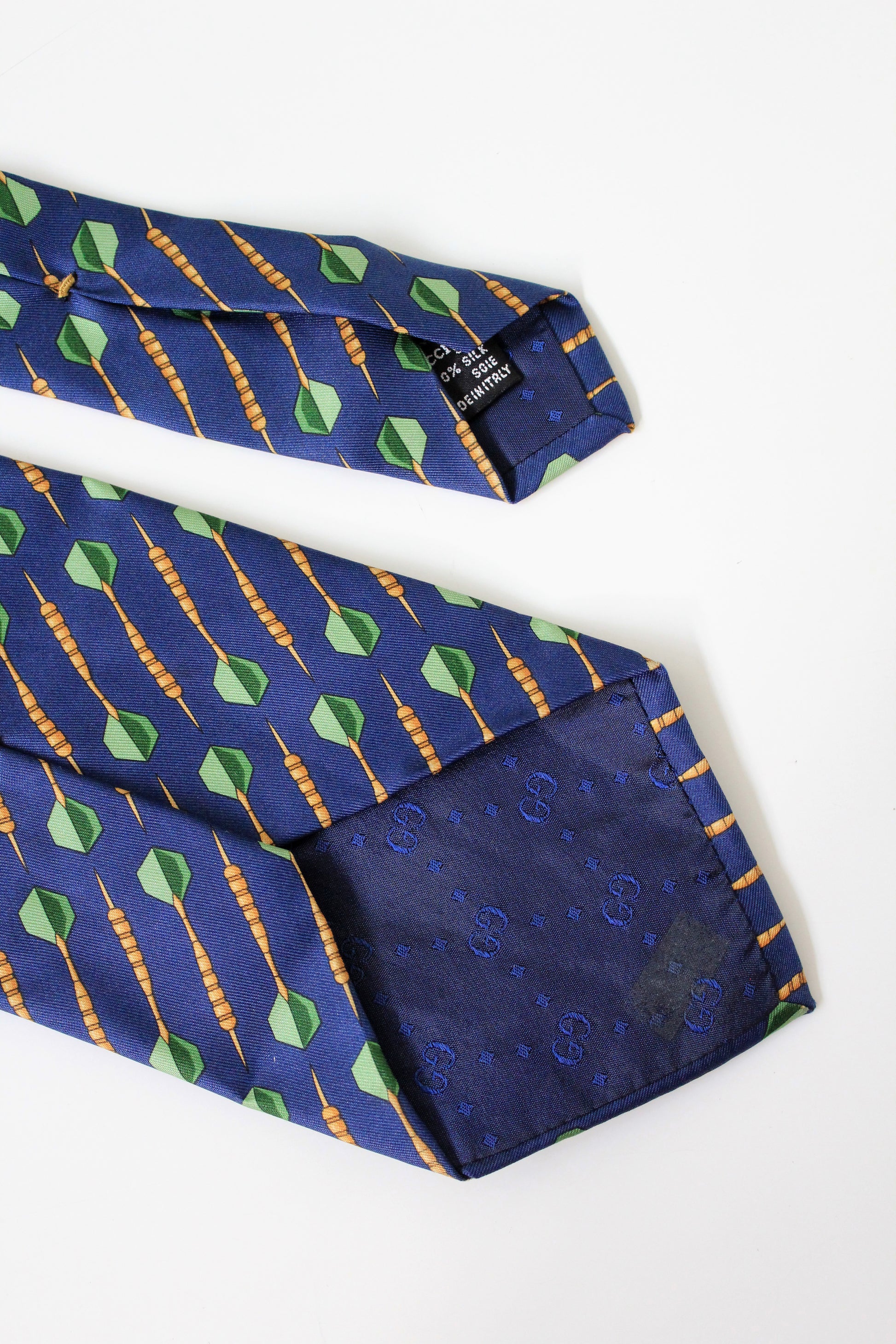 1990s Gucci Navy Blue With Repeating Darts Designer Silk Tie