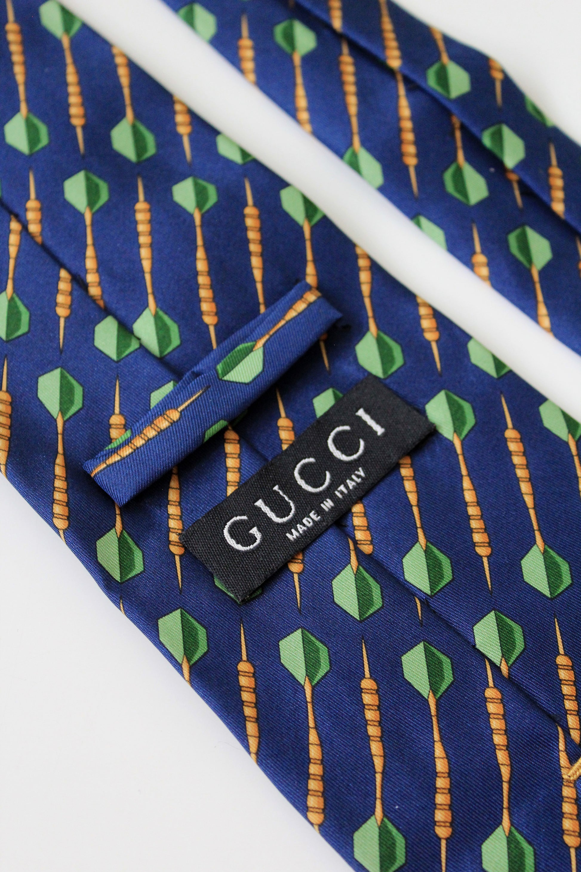 1990s Gucci Navy Blue With Repeating Darts Designer Silk Tie
