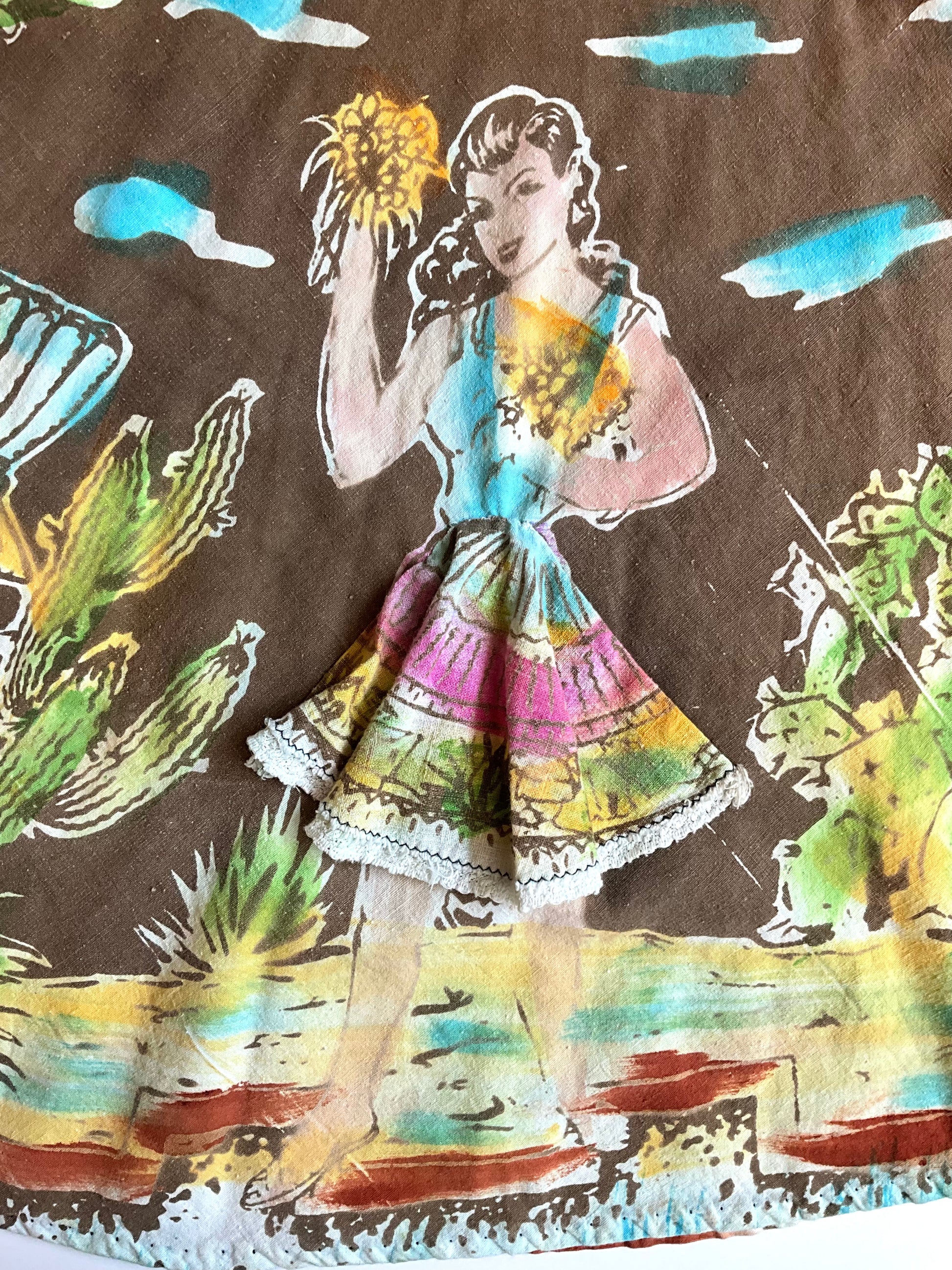Fabric with a colorful illustration of a woman and cacti on a brown background