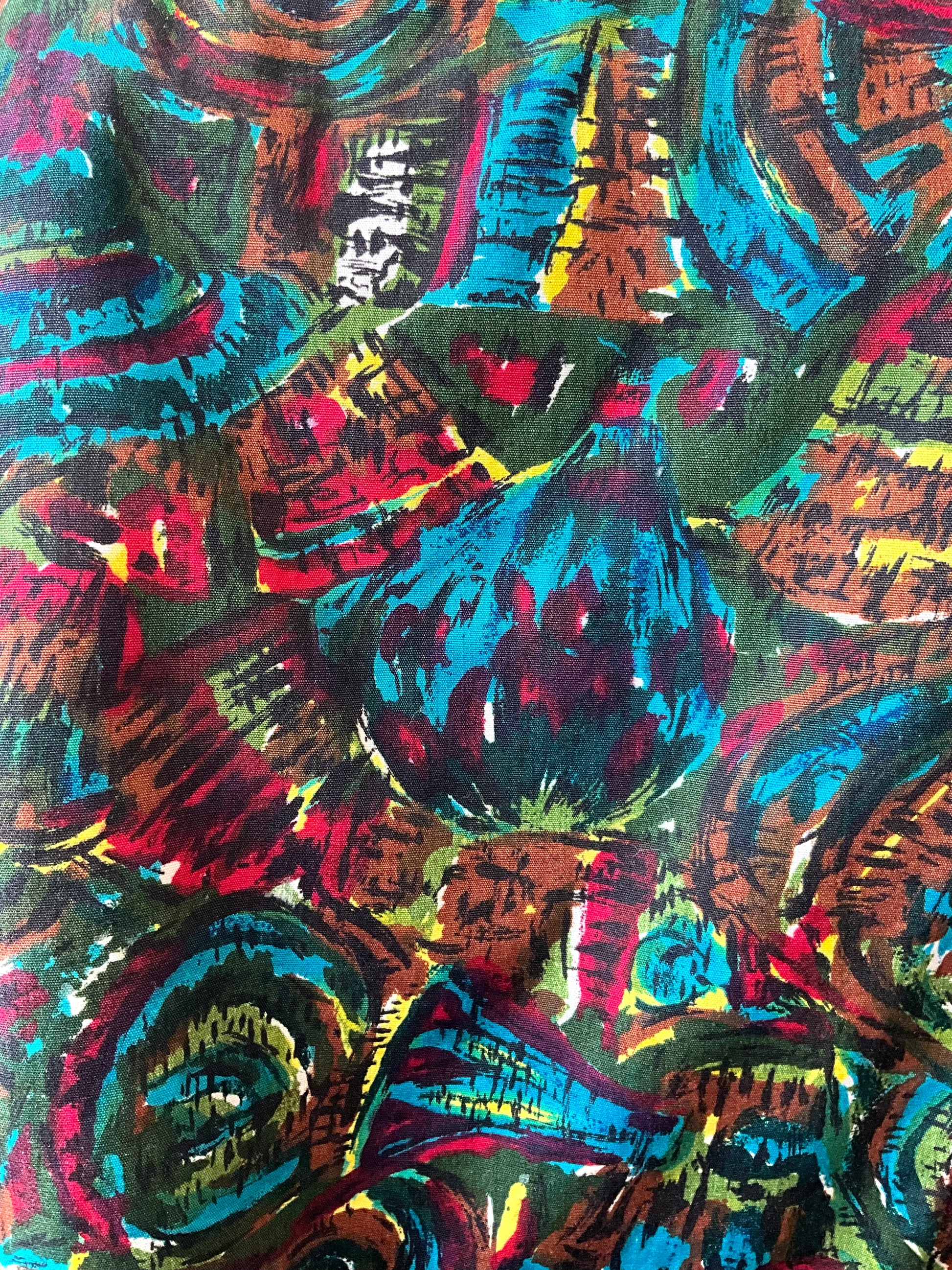 Colorful abstract pattern with swirling designs in red, blue, green, and black.