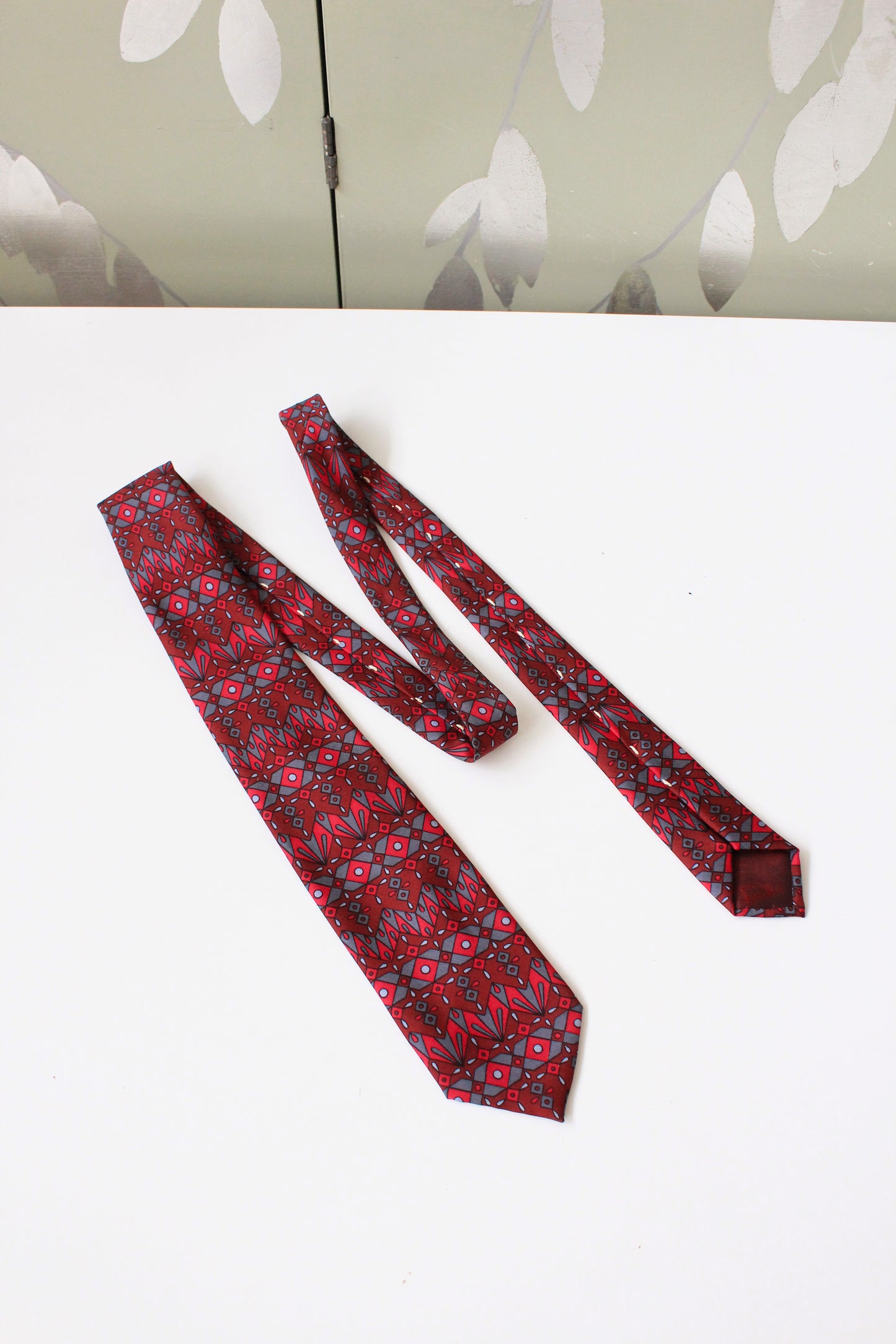 1990s Emilio Pucci Burgundy And Red Geometric Print Designer Silk Tie