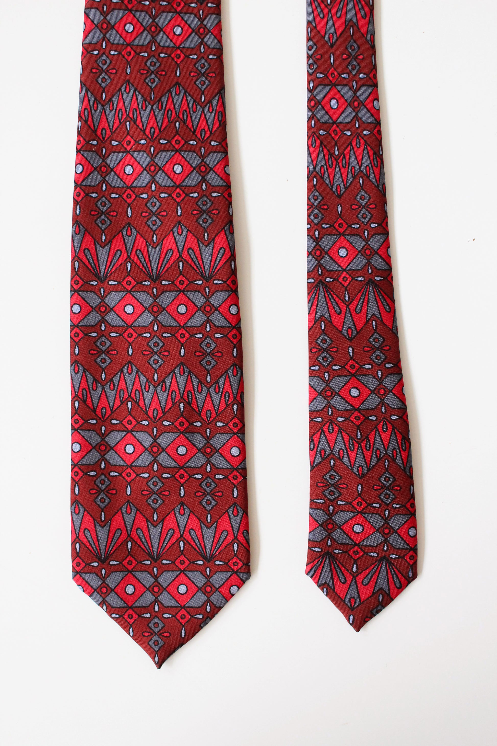 1990s Emilio Pucci Burgundy And Red Geometric Print Designer Silk Tie