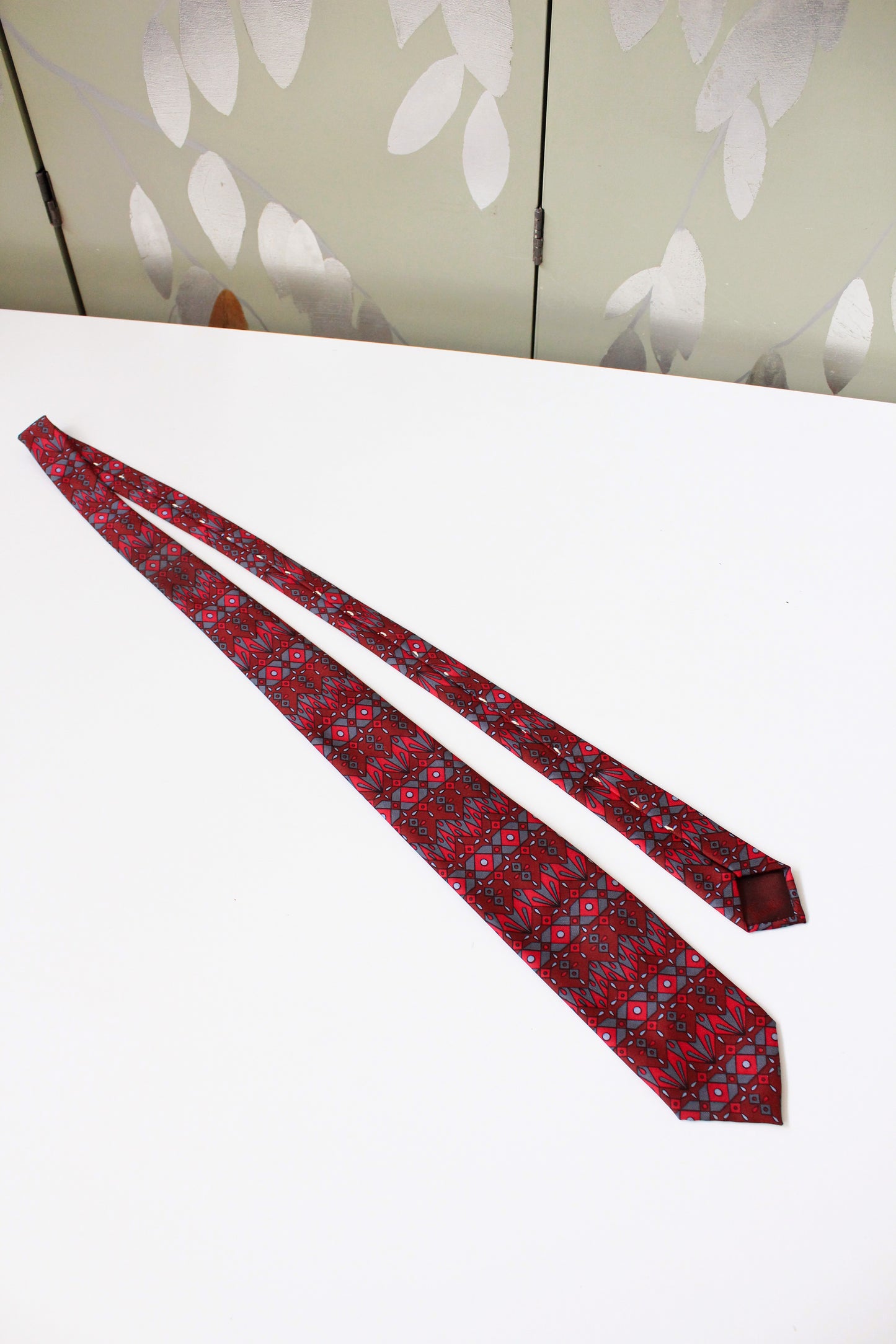  1990s Emilio Pucci Burgundy And Red Geometric Print Designer Silk Tie