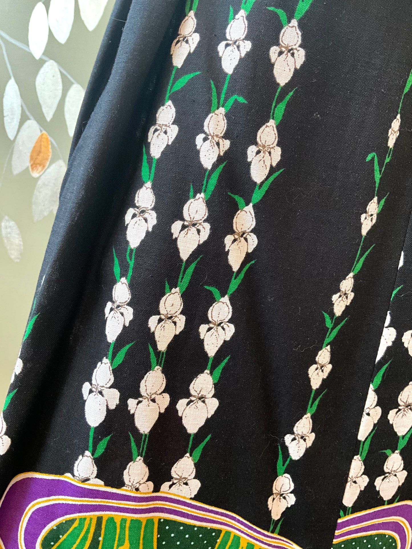 Close-up of a black fabric with white floral pattern