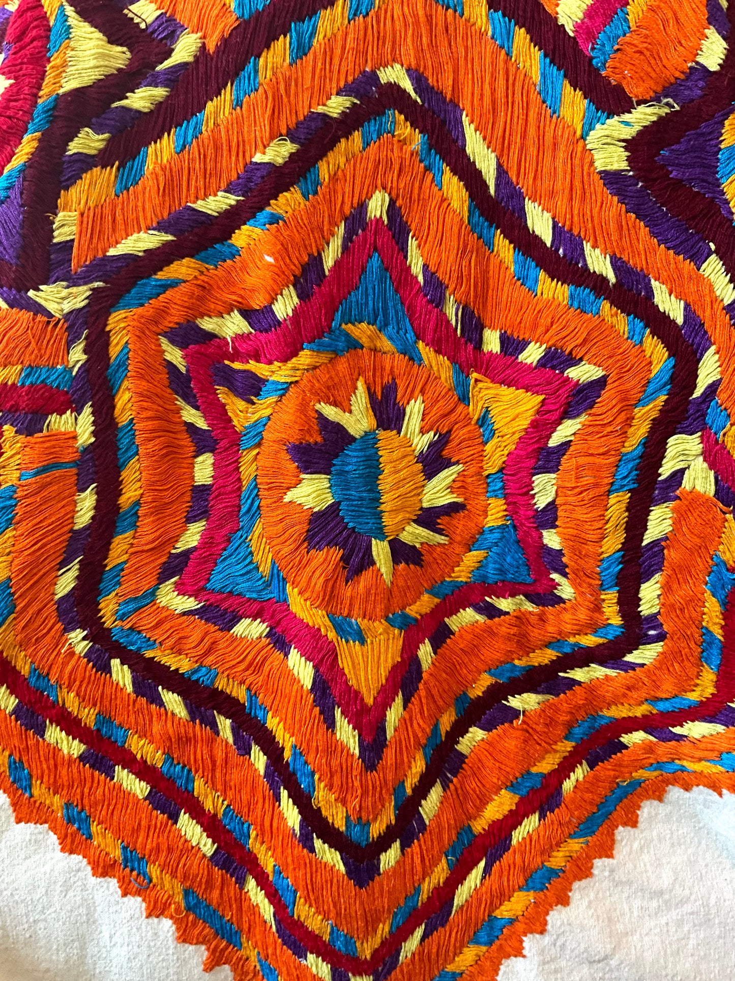 Colorful embroidered fabric with geometric pattern