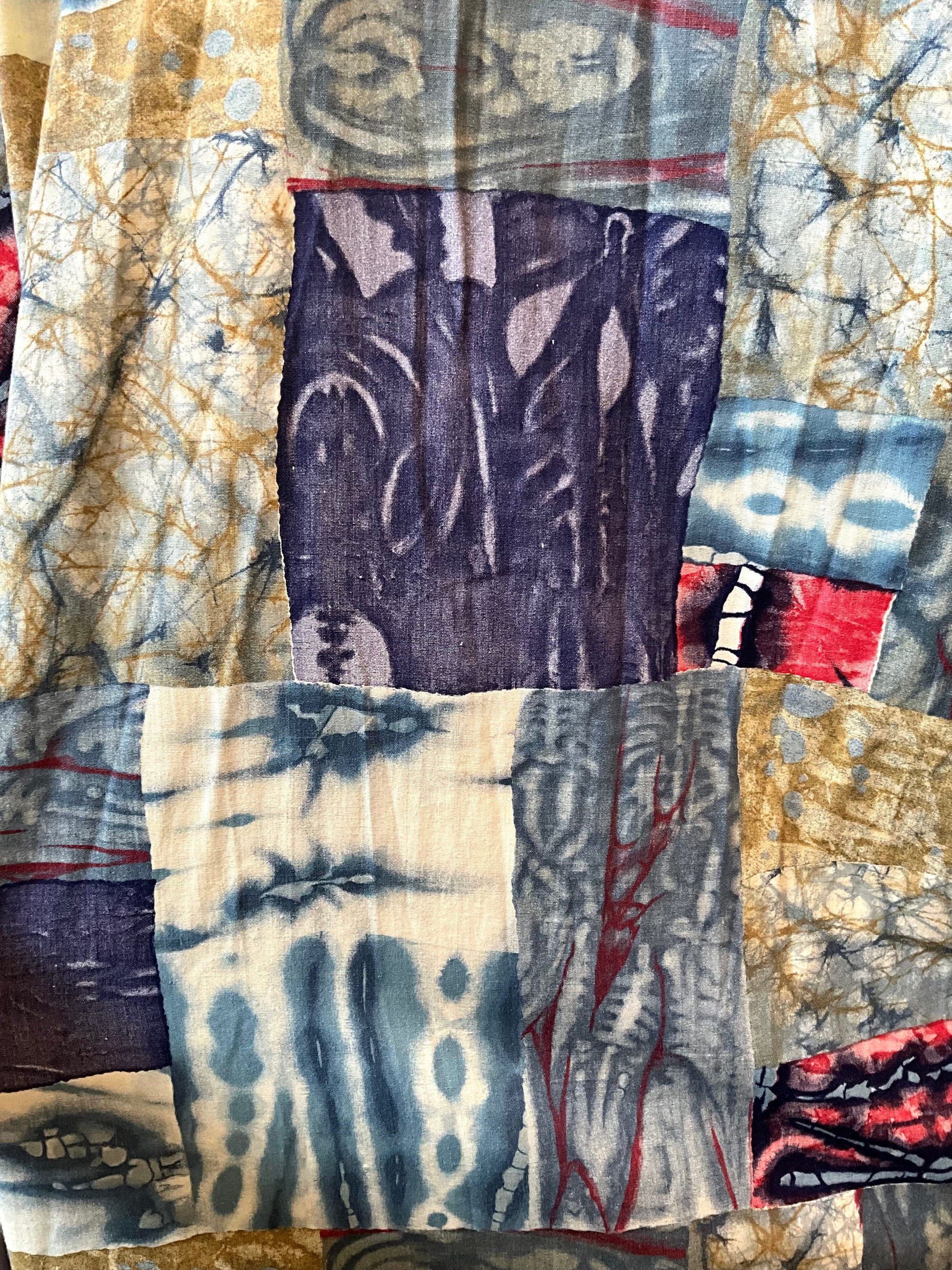 Patchwork of various fabric patterns with a focus on batik designs.