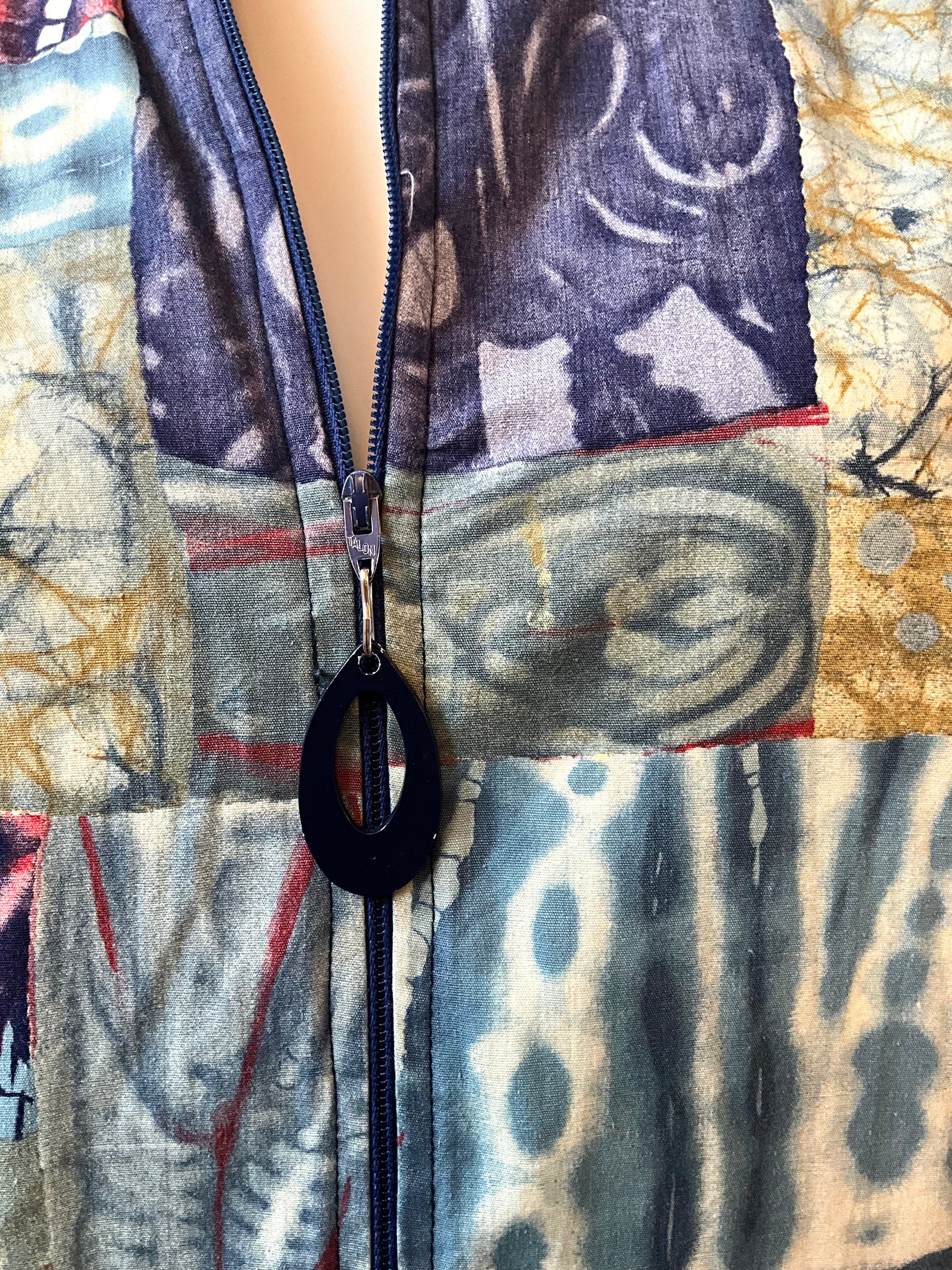 Close-up of a patterned fabric with a zipper 