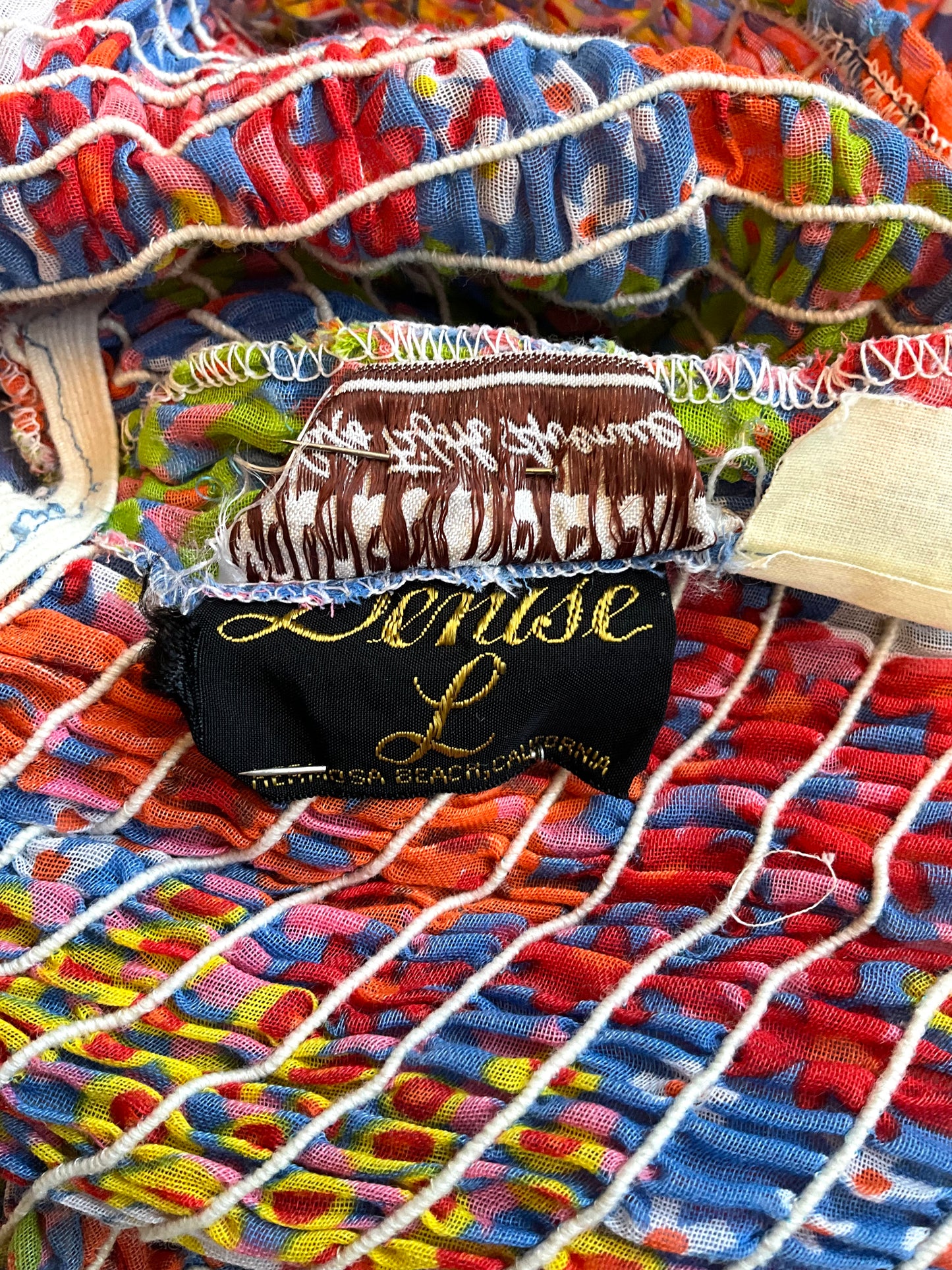 Colorful dress with label 'Denise L' 